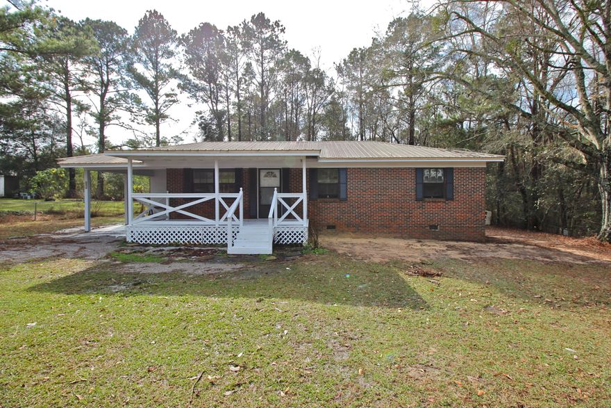 Brick 3 bedroom house on 1 acre in desirable Eucheeanna valley area but only 5 minutes to town. Big 22x10 back deck and 18x8 front porch too. Great starter home or rental. Living room open to dining area, where french doors open up to your back deck. One acre total with appx half cleared and half wooded. Not many homes in this very affordable price range!