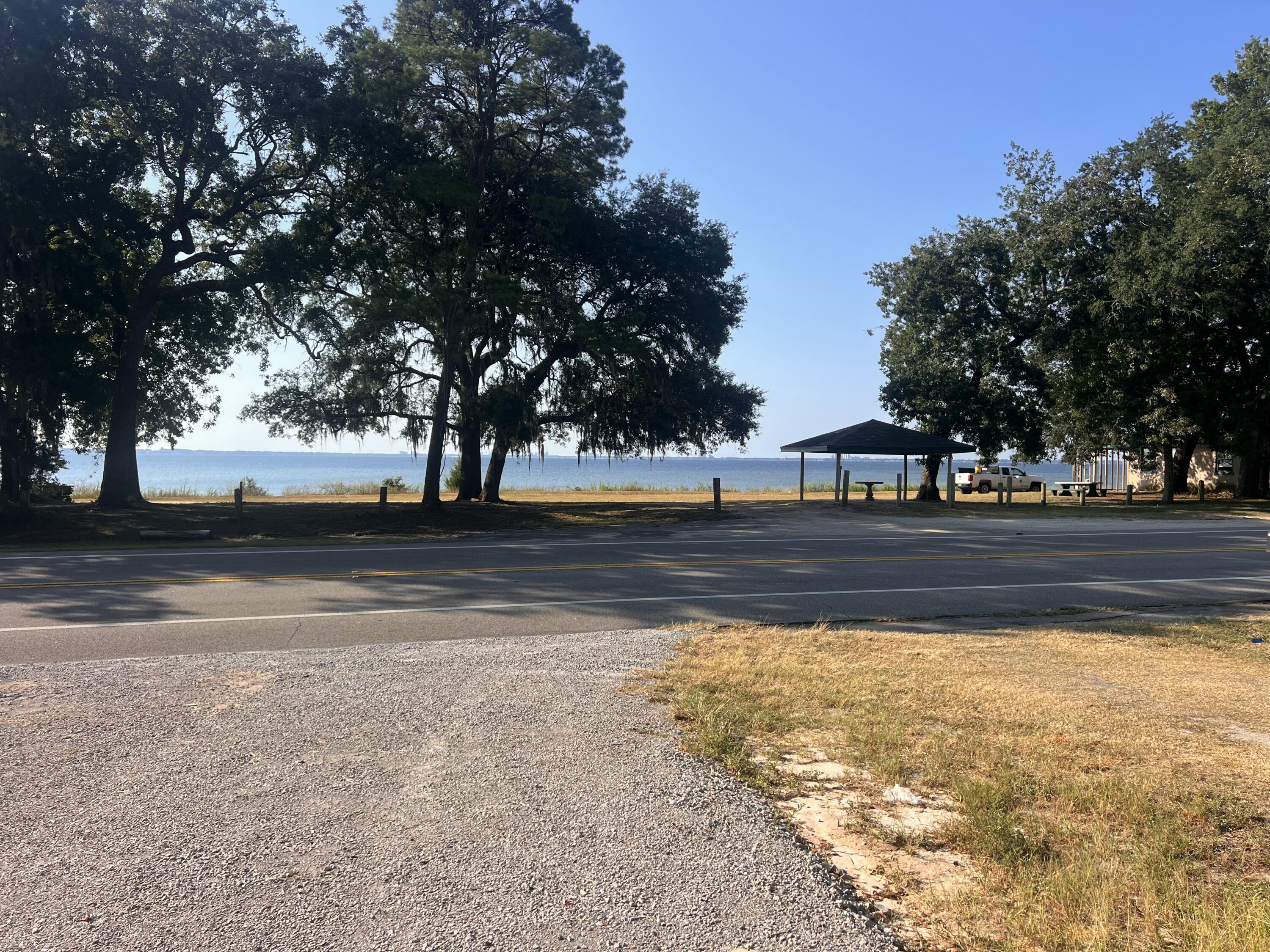 A beautiful cleared lot overlooking the Choctawhatchee Bay, ready to build your dream home! This property is directly across from a water front county park, offering unobstructed views and breathtaking bay sunrises. Improvements are already in place, including a new septic tank, site leveled for a home, a new shed, a packed gravel driveway and water meter. The seller has home plans available. This lot is truly ready to build, stop by and take in your future view today.