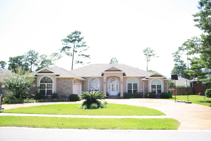 MUST SEE!!!! Seller to contribute to Buyer's closing costs. An elegant home in an upscale neighborhood located in the heart of Niceville with exceptional curb appeal. The home opens to 2,575 sq. ft. of open living space featuring laminate floors throughout the main living area, formal dining area and continues into the kitchen which features a breakfast bar. The spacious kitchen features granite counter tops, & stainless steel appliances. The main living area is spacious with a gas log fire place and built-in shelves for collectibles or electronic home theater equipment. The main living area opens to a lanai, heated swimming pool with a spa water fall and all are contained within a screened enclosure. A full bath is accessible from the pool via the lanai. The family dining area off the kitchen features French doors that also open to the lanai and pool enclosure.  Adjacent to the front door a spacious in-home office or perhaps a library with full natural light through the arch transom window.  The master bedroom is generously spacious with tray crown molding. Double doors open to the master bath is extremely wide with his and her closets on either side of the access. The master bath features cultured marble finishes in the elevated Jacuzzi bathtub with large vanity. The master bedroom is generously spacious with tray crown molding. bath also features an extra large cultured marble walk-in shower enclosure with built-in seating and toiletries' shelving. The guest bedrooms feature laminate floors and a convenient Jack & Jill bath with cultured marble vanity. The second bedroom features a large media room wired for your high speed computers and gaming systems. The circular driveway is great for overflow traffic for entertaining. The property features superior professional landscaping with cast water fountain under the bedroom window. Spacious over sized two car garage features exceptional storage with built-in work benches and matching storage cabinetry.  Adjacent laundry room is large enough for folding tables, hangar racks and freezer. This home offers easy access to Bayshore Drive that offers the perfect afternoon walk or run.  Buyer to verify all dimensions.  