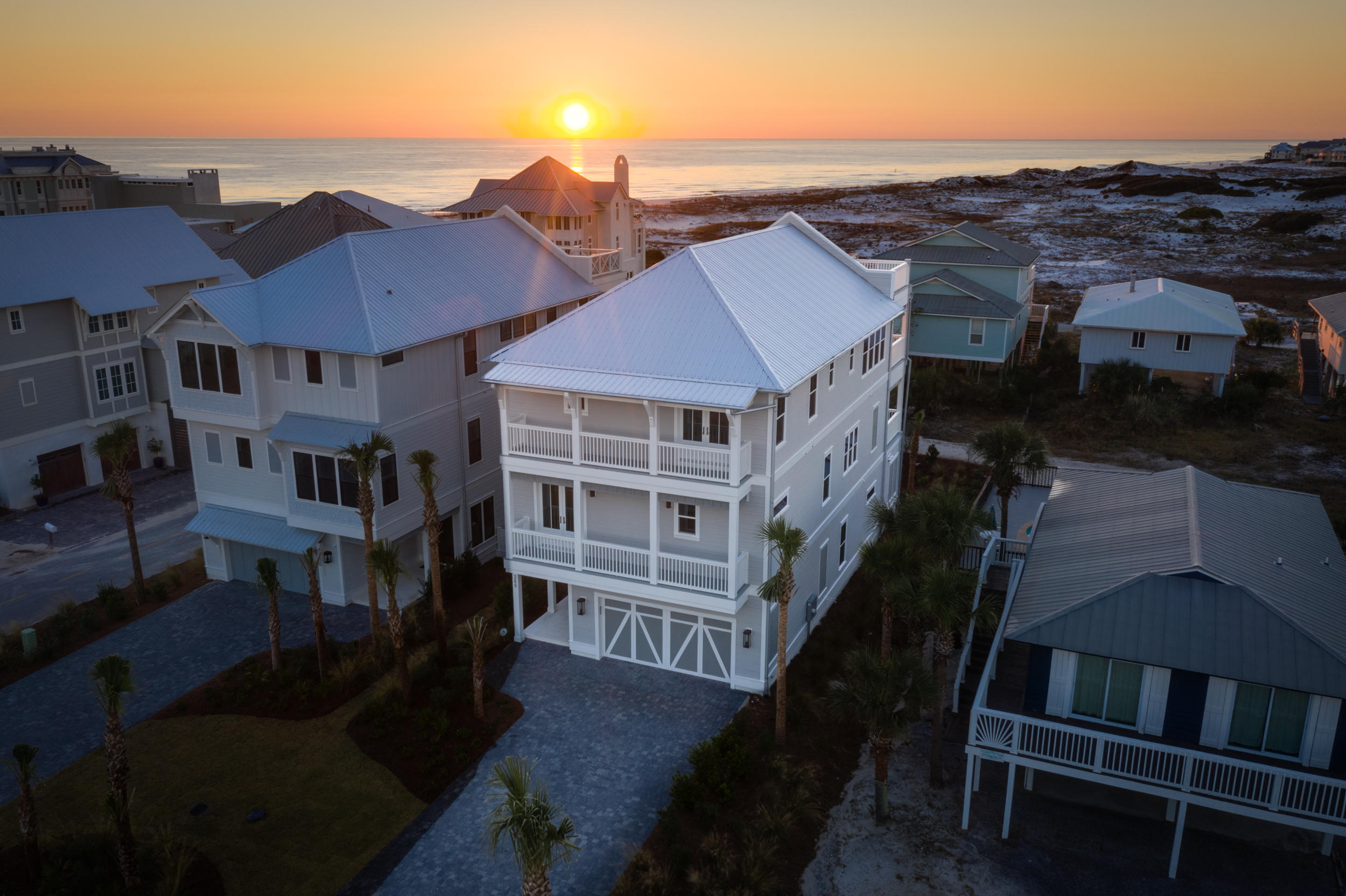 Under Contract- But taking back up offers! Located in #1 ranked Grayton Beach in a gorgeous location where the sand dunes & crystal-clear gulf water dominate your everyday views.  So many activities to enjoy here- SUP on Western Lake, short walk to the beach and stroll to newly rebuilt Red Bar for dinner! This custom masterpiece home is sure to impress even the most discerning buyer. Coastal finishes woven with transitional clean lines make this home so visually pleasing and relaxing. 1st floor features a great entry way where the beautiful herringbone pattern floor tile is showcased. There's a guest room on this ground level that is large enough for a king bed and also a laundry room fully equipped with 2 sets of washer and dryers and cabinets for storage.