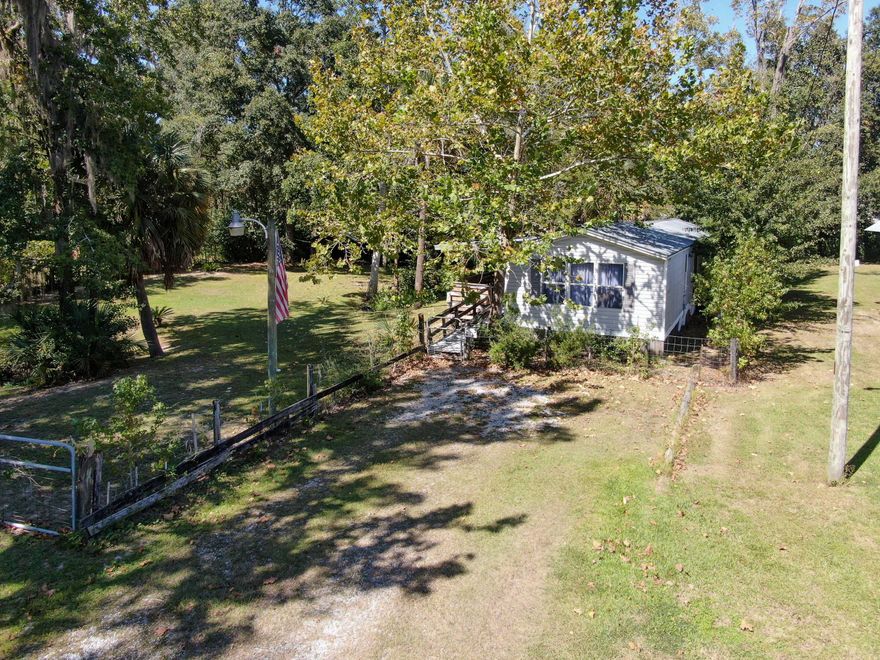 Seller is only accepting cash offers; no financing offers! Come check out this great location in Downtown Freeport, FL right around the corner from the sports complex at Hammock Bay.  Half acre +/- lot waiting for your own personal touch. Currently has a 3 bedroom, 2 bath single wide manufactured home; sold AS IS. Zoned R3 with the City of Freeport. Come check it out before it's gone.