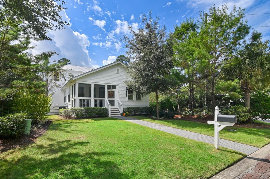 This meticulously maintained Point Washington property features a primary residence and an accompanying carriage house located less than half a mile from Choctawhatchee Bay. The carriage house offers versatile accommodations, ideal for use as a private guest suite, supplementary family living quarters, or potential rental income.The main level of the home comprises three bedrooms and two bathrooms; currently, the third bedroom is well appointed as a sophisticated home office with custom built-in shelving. The kitchen is equipped with premium stainless-steel appliances, granite countertops, and a gas range. Custom window treatments are installed throughout, and the residence has been professionally decorated, with the option to purchase the furnishings availabl A screened back porch provides an inviting space for relaxation, whether for morning coffee, entertaining guests, or enjoying an evening beverage.
Second-floor access is provided internally as well as through a separate entryway. The carriage house functions as a fully furnished apartment or mother-in-law suite, complete with a full kitchen, laundry facilities, a spacious bedroom, bathroom, walk-in closet, and plantation shutters. An additional screened porch on this level overlooks the landscaped backyard.
The grounds include mature fig and orange trees, an herb and vegetable garden, and ample room to accommodate a future pool. Rear parking offers 960 square feet with the opportunity to add a garage or carport if desired.
Grayton Bayou is a distinguished residential community featuring brick-paved streets, a neighborhood pool, and bayfront access at Bayside Ranchettes. The prohibition of short-term rentals fosters a tranquil, walkable environment and reinforces the community's strong residential character.
