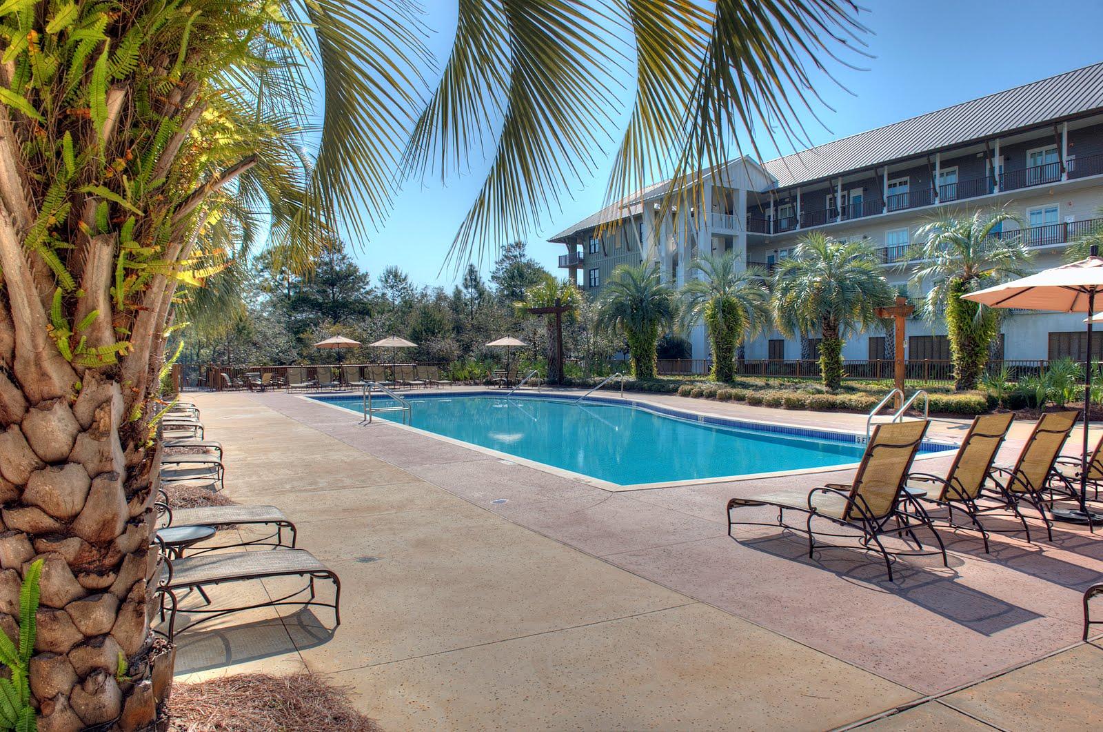 This Beautifully furnished spacious two-bedroom, 2.5 Bath condo with bunks is located in the highly coveted building 2 at Redfish Village. This unit has 1 deeded covered parking space and is a 30 second walk from the owners lounge and pool facilities. This unit features hardwood floors, granite countertops, Viking and Jenn Air appliances. The unit conveys fully furnished with new furniture with an excellent rental history that gross over $30,000 a year. Redfish Village is located in Blue Mountain Beach, and features beautiful condominiums that are ideal as a second home, a vacation property, or a year-round residence. This growing village community was specifically designed to connect residents with nature, and features a scenic trail along the wooden boardwalk down to the lake.
