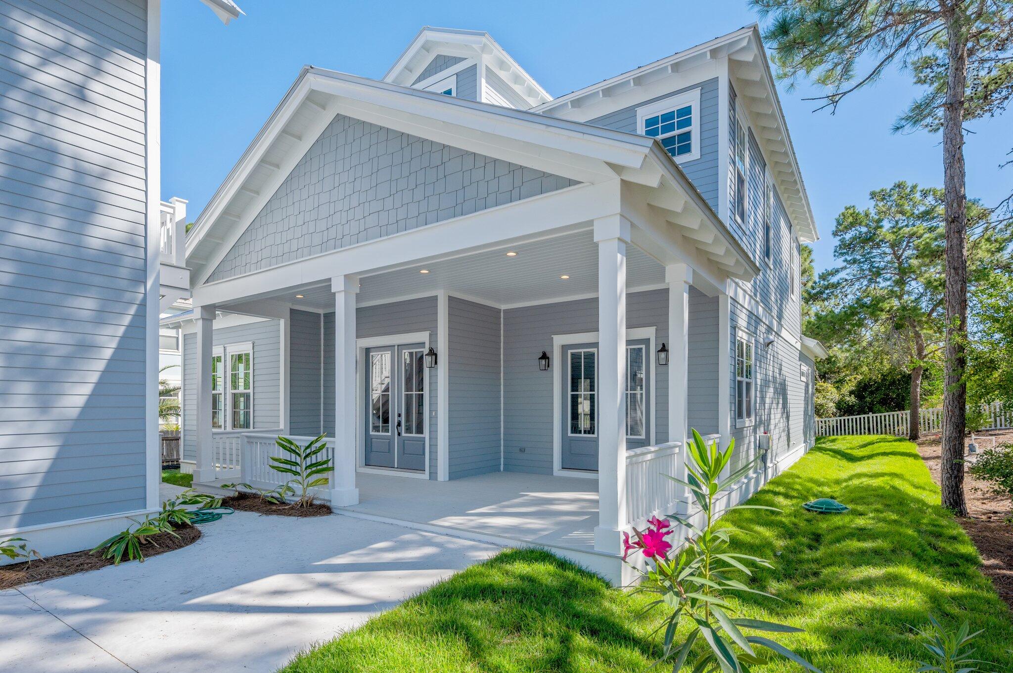 Welcome to one of the most desirable non-HOA communities on 30A, where this custom-built home offers an extraordinary blend of luxury, comfort, and prime location. The main house boasts 4 BDR plus a bunk room, heated/cooled storage room, 3 bathrooms , two inviting living areas, and two large porches overlooking Santa Rosa Beach Country Club. The gourmet kitchen is equipped with high-end appliances, a generous breakfast bar, and an elegant dining area. For added versatility, the property includes a separate lockout carriage house above the oversized two-car garage. Complete with 1 bedroom, 1 bathroom, a full kitchen, living area, and a bunk room.  This home is designed for seamless indoor-outdoor coastal living in 30a