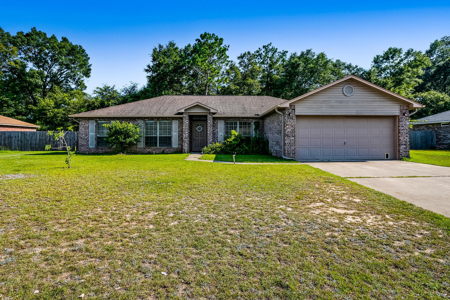 VIDEO TOUR AVAILABLE! Located in Harvest Point , this beautiful and well maintained home with plenty of room for your family is located just minutes from Whiting Field! This is a family friendly neighborhood with plenty of children in the neighborhood. This popular floor plan has 4 bedrooms plus a formal dining room which could also be used as an office. The kitchen has stainless steel appliances (fridge doesn't convey) and granite counter tops and a breakfast area. The vaulted family room has gorgeous laminate wood flooring and patio doors to a privacy fenced yard and patio for grilling. The master bath has a separate tub and walk-in shower with his and her closets. The other three bedrooms have laminate wood flooring as well. Make your appointment today before this one goes!