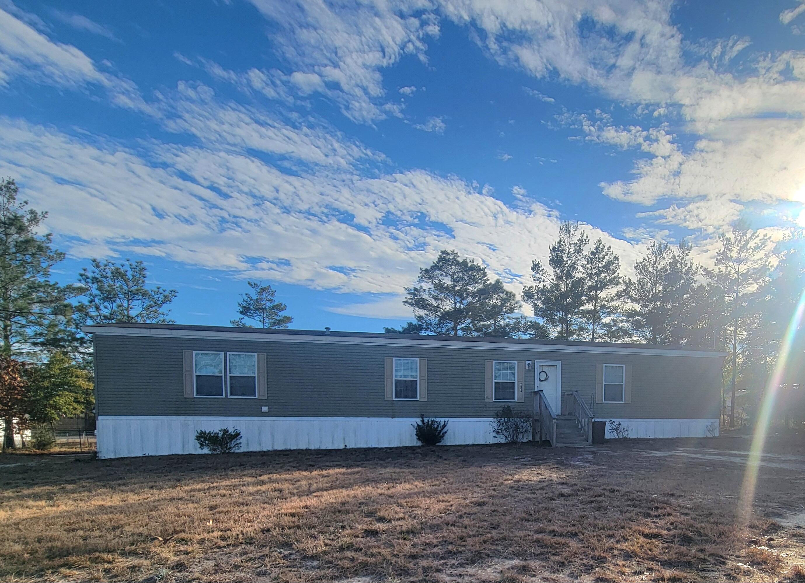 Affordable living in this 3 bedroom 2 bath home with 1216 s.f. Central air and heat built in 2018 located on 3 (THREE LOTS), totaling .69 acres. All appliances are included, refrigerator, dishwasher, washer/dryer, microwave and  new stove top.  No HOA and within 7 miles of I-1-10 exit at Mossy Head and only 30 minutes to Eglin AFB or Crestview.  Destin Beaches are 40 minutes away.   Eligible for FHA, VA or Conventional financing.