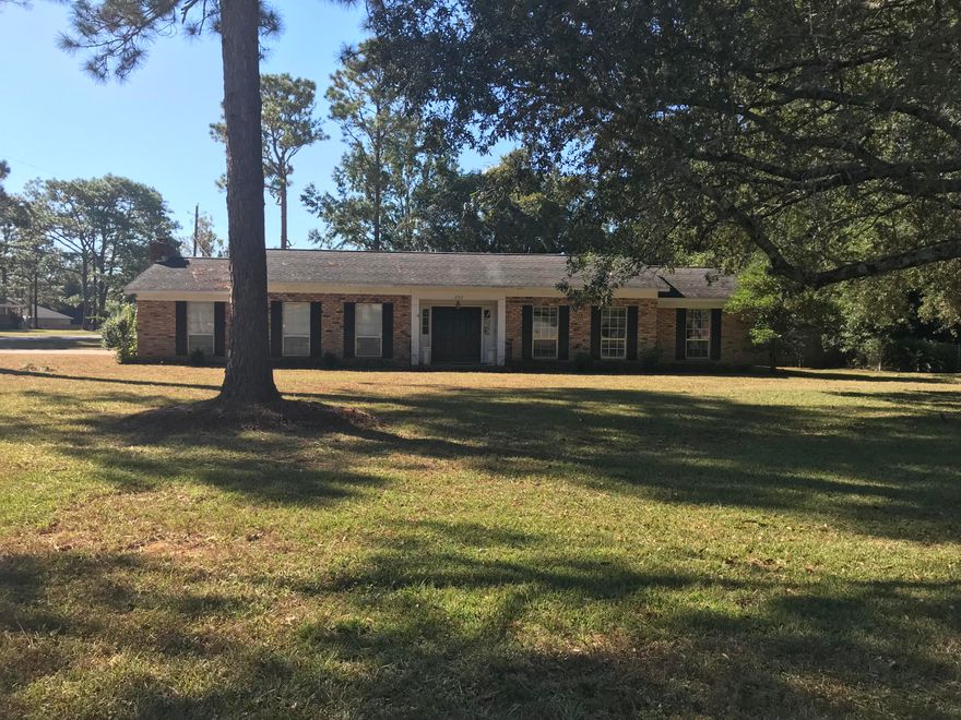 Lovely 3 bedroom 2 bath home is located in the established neighborhood of Adams Powell Subdivision.  This house has been well maintained.  The spacious living room features a handsome brick wood burning fireplace.  Fireplace is surrounded by bright white cabinets and wall to wall brick hearth.  Kitchen has lots of storage, double level Island bar, pantry and separate cook top-wall oven.   Master suite is carpeted .  Lots of extras outside.  Covered patio and Extra storage area located by the carport.  Don't miss this one.