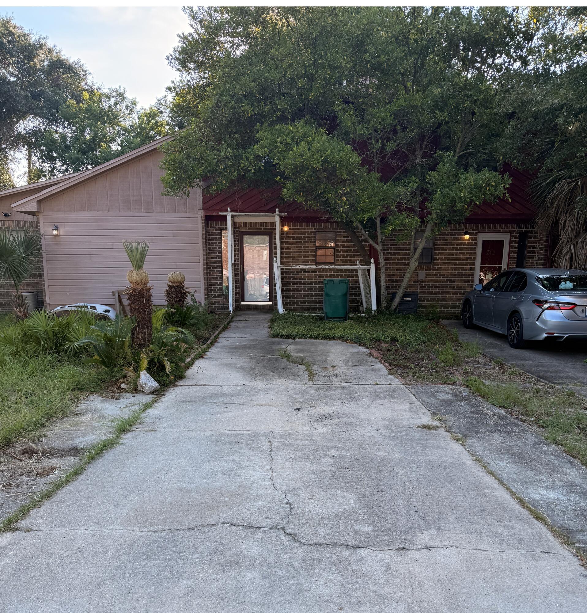 Investor Special! This 2-bedroom, 1.5-bath townhome in the heart of Fort Walton Beach is a prime renovation and resale opportunity, priced to reflect the updates it needs. The layout features a spacious kitchen with pantry that opens to a large living/dining are. The Living Room has sliding doors to a screened porch and utility closet, and a privacy fenced backyard. Upstairs there are two large bedrooms, including one with an oversized walk-in closet, plus a full bath and hallway linen closet. With an inside laundry/utility room, strong rental potential, and desirable location, this is an excellent flip or income-producing investment. Strictly sold 'AS-IS' cash or hard money loans. Don't miss this chance on a great investment!