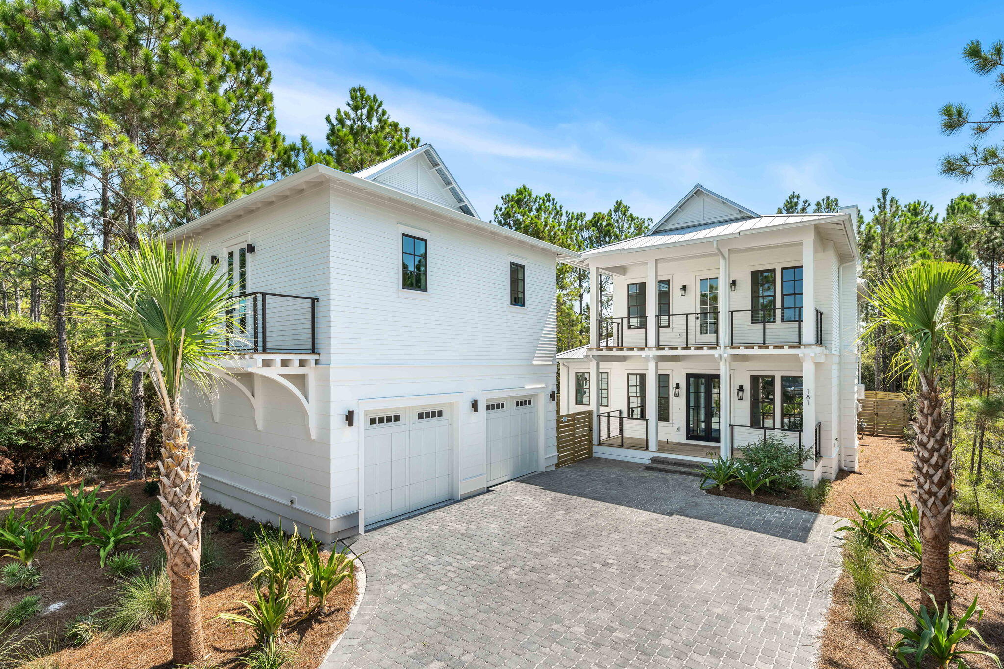 Welcome to 181 Plantation Circle, a BRAND NEW custom home located in the sought-after gated community of Cypress Breeze Plantation. Just minutes from the sugar-white sands of 30A and the vibrant energy of Gulf Place. Situated on an expansive, nearly half-acre lot, this property backs up to a peaceful wooded preservation area, offering rare privacy, room to roam, and a serene natural backdrop, all while keeping you close to the best of beachside living. With top-of-the-line finishes and an open, inviting layout, this home is truly a decorator's dream, designed for both comfortable living and effortless entertaining. The spacious main living area features a chef's kitchen with custom cabinetry and Viking appliances, a butler's pantry complete with wine fridge and microwave, a cozy fireplace in the family room, and a light-filled dining space. Also on the first floor, you'll find a generous primary suite with a spa-inspired ensuite featuring a soaking tub, walk-in shower, dual vanities, and separate closets. A thoughtfully designed laundry/mudroom adds everyday functionality with built-in cabinetry, washer and dryer, and even a dog wash station, perfect for beach days or muddy paws.
Upstairs, the second primary suite offers a luxurious ensuite bath and access to a private covered porch, ideal for morning coffee or evening cocktails. Two additional bedrooms provide space for guests or family, with one perfectly suited as a fun bunk room. A full bathroom is located just off the hall, along with a versatile loft area ideal for a home office, playroom, or media zone.
Just off the main home, a charming courtyard will soon feature a summer kitchen and firepit area, leading to the private-entry carriage house. Complete with its own living area, kitchenette, bedroom, and full bath, it's perfect for hosting guests, multi-generational living, or generating rental income.
Cypress Breeze Plantation offers one of the largest residential pools on the Emerald Coast, along with food trucks, seasonal events, and a strong sense of community. HOA dues include access to recreational amenities, management, and community maintenance, giving you peace of mind and more time to enjoy life by the beach. Whether you're looking for a full-time residence, vacation retreat, or investment property, 181 Plantation Circle delivers the ideal blend of privacy, luxury, and location.