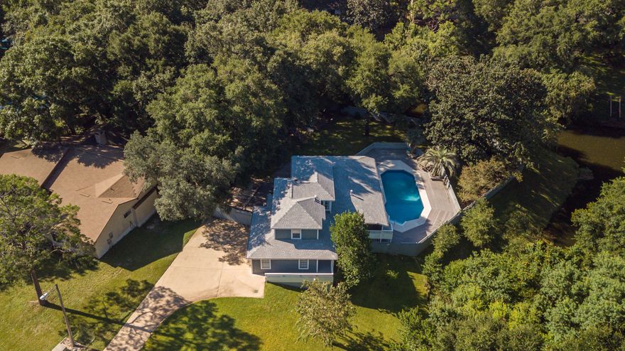 Welcome to the most unique home in Rocky Bayou! This beautiful 3 story, 6 Bed, 3.5 Bath home, with private pool boasts custom details throughout, nothing has been overlooked! The main floor features gorgeous hardwood floors, new tile, renovated kitchen, spacious living room, dining room, laundry/mudroom & half bath. Also on the main floor, a tranquil Master Suite with private access to the screened in porch. The upper level is a split floor plan with two large bedrooms and full bath. Downstairs you will find the ultimate guest suites with separate kitchenette, bathroom, family room & game room. Enjoy your private outdoor living space to the fullest while hanging out poolside. This huge, meticulously kept yard has plenty of space for a boat or RV and so much more!