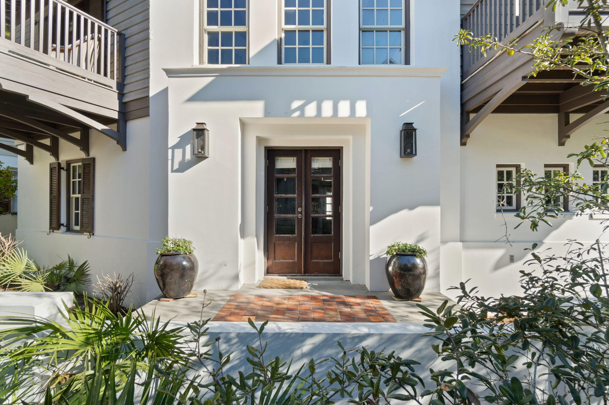 Discover the fine craftsmanship and graceful charm Tortuga Cottage has to offer, right in the heart of Rosemary Beach's iconic south side. This charming 5 bedroom, fully furnished home just off the boardwalk is a mere few minutes' walk to both shopping and dining as well as the beach. The large courtyard, perfect for alfresco entertaining, leads to a double door entry where the homes elegance showcases an open living room/dining room with volume ceilings, fireplace, walls of windows & adjoining the professionally equipped kitchen. There is a private suite on the main level as well as a half bath for guests. A 2nd floor walkway overlooks the main level and leads to two additional bedroom suites.  Also on the property is a 2-car garage and carriage house featuring a spacious living area, fully equipped kitchen area, queen bedroom and twin bedroom loft. This is one of the most ideal locations in Rosemary Beach.

