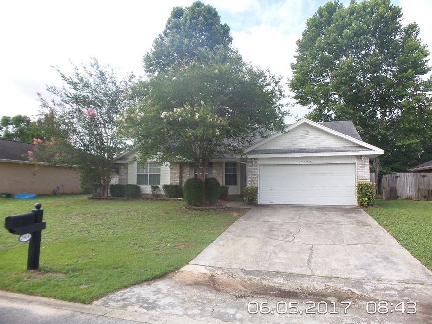 All brick home in South Crestview. This little beauty is priced right for a quick sell. This large 3 bedroom home features cathedral ceilings with large living room. This home also features Laminate Wood Flooring everywhere but the wet areas, which have tile. the large kitchen has plenty of counter space. The large master features double closets and a master bath with double vanities. This home is completed nicely with the privacy fenced big back yard and great out building. All closing costs paid with preferred lender.