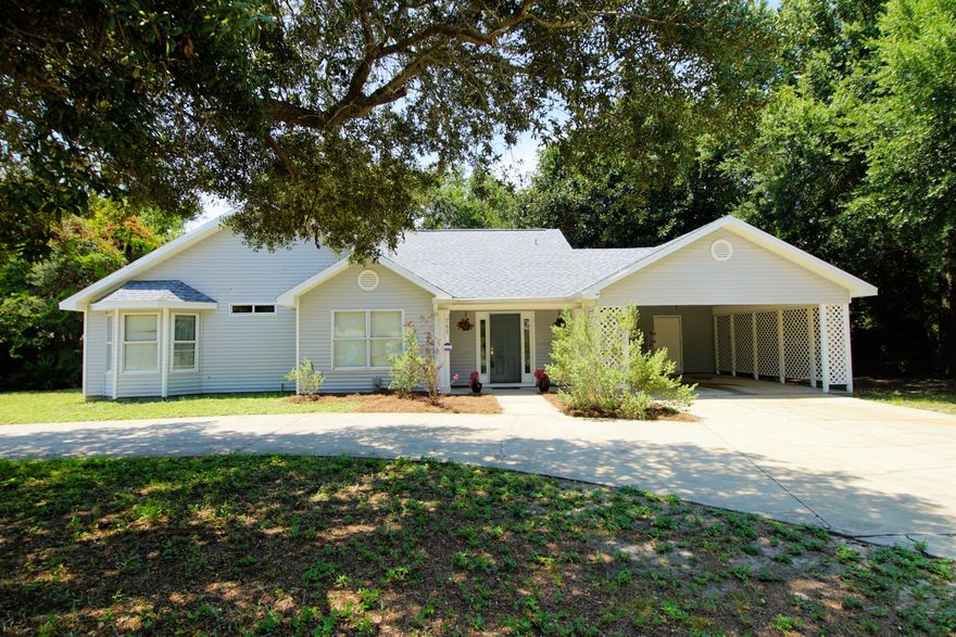 Located in the Heart of West Destin and right around the corner from Destin Elementary and the Duck Pond. Launch your boat at nearby Joe's Bayou. All bedrooms and living space located on 1st floor. A loft located on second floor may be used as extra bedroom, play room, or office. Vinyl siding for ease of maintenance. Plenty of parking for cars and boats in circular drive with beautiful shade tree or 2 vehicle car port. Home features open floor plan, new laminate flooring in living room and new carpet in bedrooms. Kitchen has ceramic tile and is open to living area and faces cozy fireplace. Plenty of room to eat in breakfast nook area. Open front bonus room could be formal dining, den, or office . Covered porch in fenced back provides a shady place to relax and enjoy summer breezes.