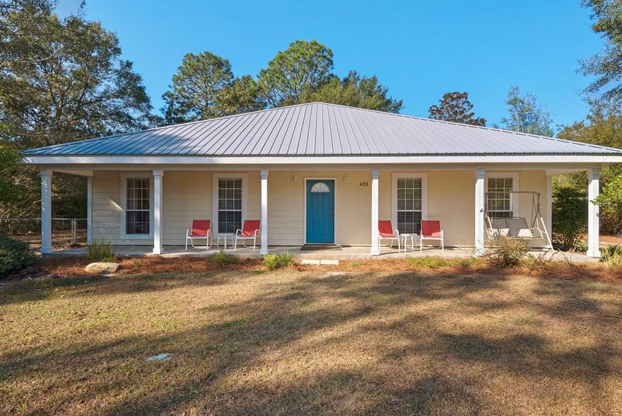 One-owner, custom built home on over an acre, just 1/4 mile to public boat launch, and a short 14 miles to the Beaches of South Walton. Home has many extra features, including Chelco-certified Energy Efficient, double paned insulated windows, metal roof, hardwood floors, wood burning fireplace, large eat-in kitchen plus formal dining room (or office/den), cathedral and trey ceilings, covered porches, and a detached 2-car garage! Master bedroom has double walk-in closets, and master bath has double vanities plus garden tub and separate shower. Only 2 rooms have carpet - rest is all tile and wood for low maintenance. Great neighborhood, no HOA fees. HUGE YARD ... plenty of room to park your boat which you will want to have for the great Bay lifestyle Freeport offers.