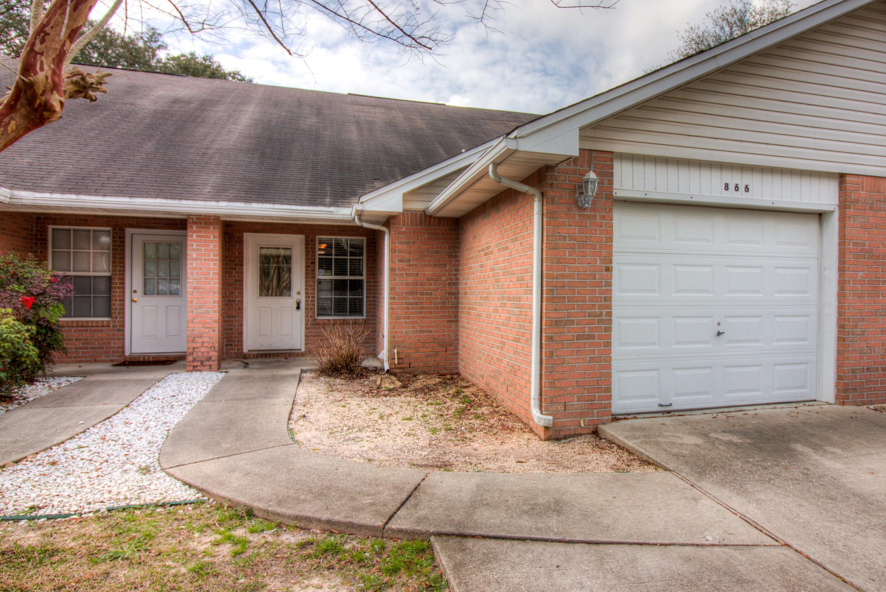 Spacious two-story townhouse located in the heart of Fort Walton Beach, 15 minutes to Hurlburt Field AFB, 17 minutes to Eglin AFB, and short drive to the most beautiful beaches in the world! Feel right at home as you enter, with open living floor plan featuring wood laminate flooring and vaulted ceilings. The authentic Chicago style masonry accents the kitchen with charm and is one of a kind. Master bedroom and bath are on lower level with two additional bedrooms and bathroom upstairs. One car garage is equipped with a large Coleman brand tool cabinet for all your tools and or storage needs. Don't miss your chance! Call Today!