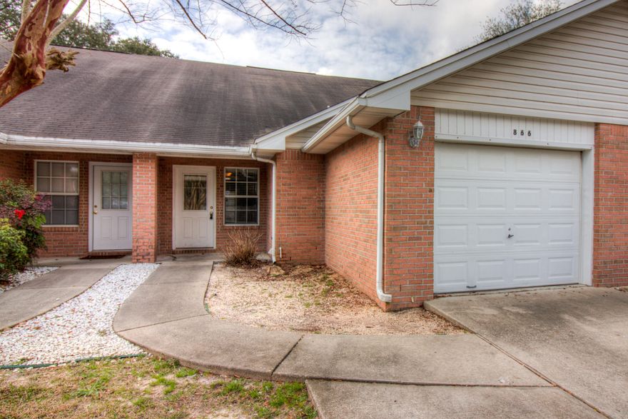 Spacious two-story townhouse located in the heart of Fort Walton Beach, 15 minutes to Hurlburt Field AFB, 17 minutes to Eglin AFB, and short drive to the most beautiful beaches in the world! Feel right at home as you enter, with open living floor plan featuring wood laminate flooring and vaulted ceilings. The authentic Chicago style masonry accents the kitchen with charm and is one of a kind. Master bedroom and bath are on lower level with two additional bedrooms and bathroom upstairs. One car garage is equipped with a large Coleman brand tool cabinet for all your tools and or storage needs. Don't miss your chance! Call Today!