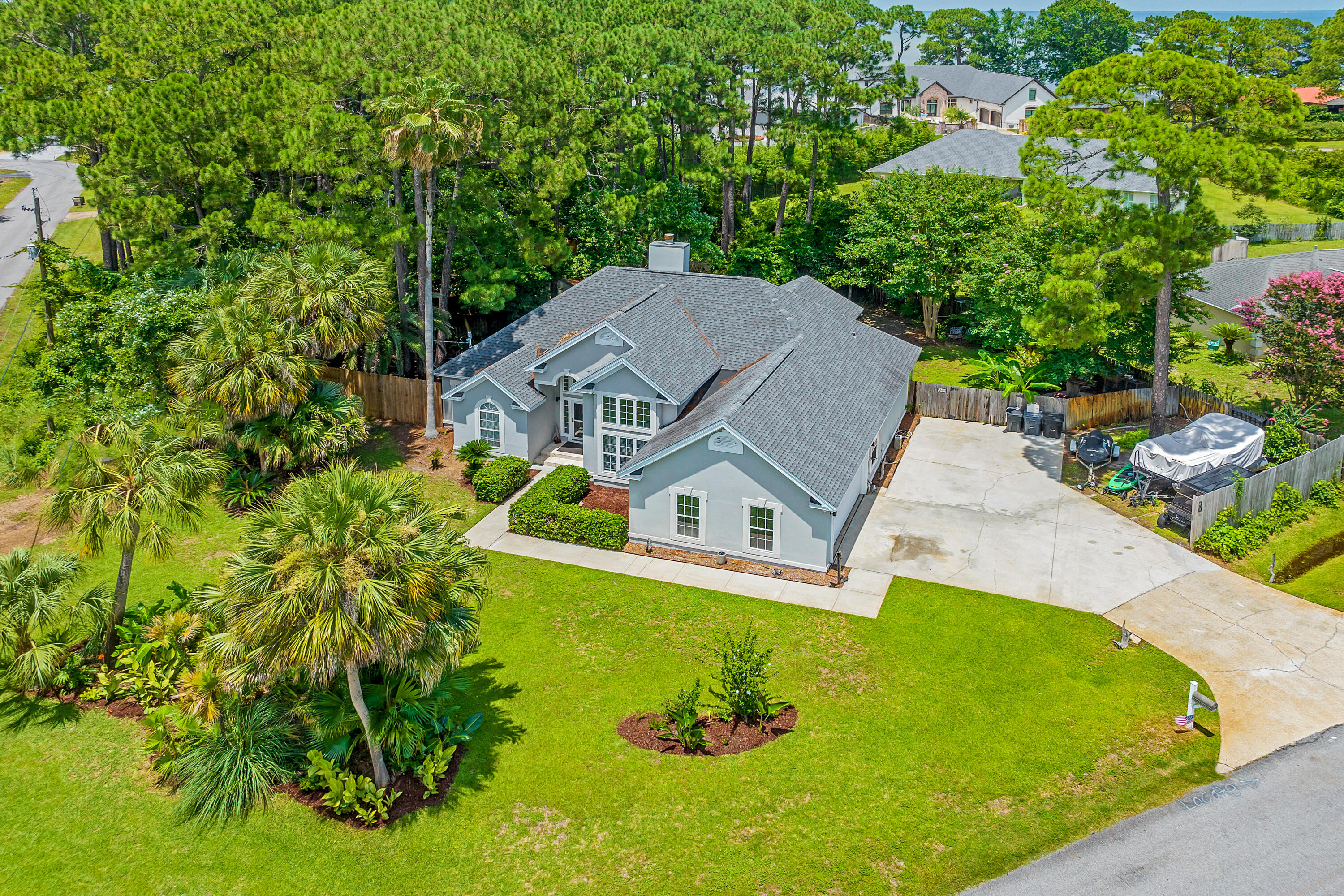 Incredible opportunity in Miramar Beach - No HOA - Over 1/3 Acre - Corner Lot - Room for Boat, Jet Skis & RV - Short Term Rental Capable - Minutes to Neighborhood Parks, Boat Launch & Beach...Gorgeous 3BR/2BA home in the popular Holiday Shores Estates community in Miramar Beach. Excellent layout maximizes space, the high ceilings & tall doorways give it a spacious airy feel & large windows with transom windows provide an abundance of natural light. Outstanding features include a seperate den that could be used as an office, library, playroom or formal dining room, a split floorplan with huge primary bedroom & sitting area, custom built closets in all bedrooms, open kitchen with breakfast bar, wine chiller, stainless appliances, beautiful hardwood floors, 2 HVAC system, 2 Hot water heaters, a large Florida Room with tons of windows overlooking the backyard and a 2 car garage. Situated on a 0.33 acre corner lot backing up to a serene wooded parcel, this lot offers rare privacy & plenty of room for all of your "toys" as well as the possibility of adding a pool or hot tub to expand your outdoor enjoyment plus there is an electric hook up for an RV. Great short term rental capability & seller will include the furniture for $705,000! Located in Flood Zone X so no flood insurance required. Quick access to Parks & Rec...Paradise Park 1 minute, Legion Park Boat Launch - 2 Miles, Haugen Bayfront Dog Friendly Park 1/2 mile, Miramar Beach Regional Beach Access - 1.9 miles - all accessible without having to get on Highway 98! Take your golf cart from N Holiday & cross at the light to S Holiday Road to get to Scenic 98. You can make your way all the way to the Destin Harbor on back roads without getting on Hwy 98. Additionally, unlike some neighborhoods in the area, there are multiple ways to get in and out of the neighborhood with a traffic light. Don't miss this special property, schedule your showing today!