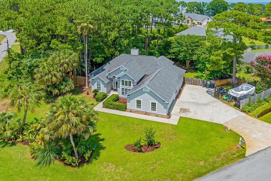 Looking for a 2nd home with room for a pool that you can rent out when not using? This house checks those boxes! Excellent Miramar Beach location with tons of privacy that is also the perfect fit for a primary residence. No HOA  - Over 1/3 Acre -  Corner Lot - Room for Boat, Jet Skis & RV - Short Term Rental Capable - Minutes to Neighborhood Parks, Boat Launch & Beach...Gorgeous 3BR/2BA home in the popular Holiday Shores Estates community in Miramar Beach. Excellent layout maximizes space, the high ceilings & tall doorways give it a spacious airy feel & large windows with transom windows provide an abundance of natural light. Outstanding features include a seperate den that could be used as an office, library, playroom or formal dining room, a split floorplan with huge primary bedroom & sitting area, custom built closets in all bedrooms, open kitchen with breakfast bar, wine chiller, stainless appliances, beautiful hardwood floors, 2 HVAC systems,2 hot water heaters, a large Florida Room with tons of windows overlooking the backyard and a 2 car garage. Situated on a 0.33 acre corner lot backing up to a serene wooded parcel, this lot offers rare privacy & plenty of room for all of your "toys" as well as the possibility of adding a pool or hot tub to expand your outdoor enjoyment plus there is an electric hook up for an RV. Great short term rental capability! Located in Flood Zone X so no flood insurance required. Quick access to Parks & Rec...Paradise Park 1 minute, Legion Park Boat Launch - 2 Miles, Haugen Bayfront Dog Friendly Park 1/2 mile, Miramar Beach Regional Beach Access - 1.9 miles - all accessible without having to get on Highway 98! Take your golf cart from N Holiday & cross at the light to S Holiday Road to get to Scenic 98. You can make your way all the way to the Destin Harbor on back roads without getting on Hwy 98. Additionally, unlike some neighborhoods in the area, there are multiple ways to get in and out of the neighborhood with a traffic light. Don't miss this special property, schedule your showing today!