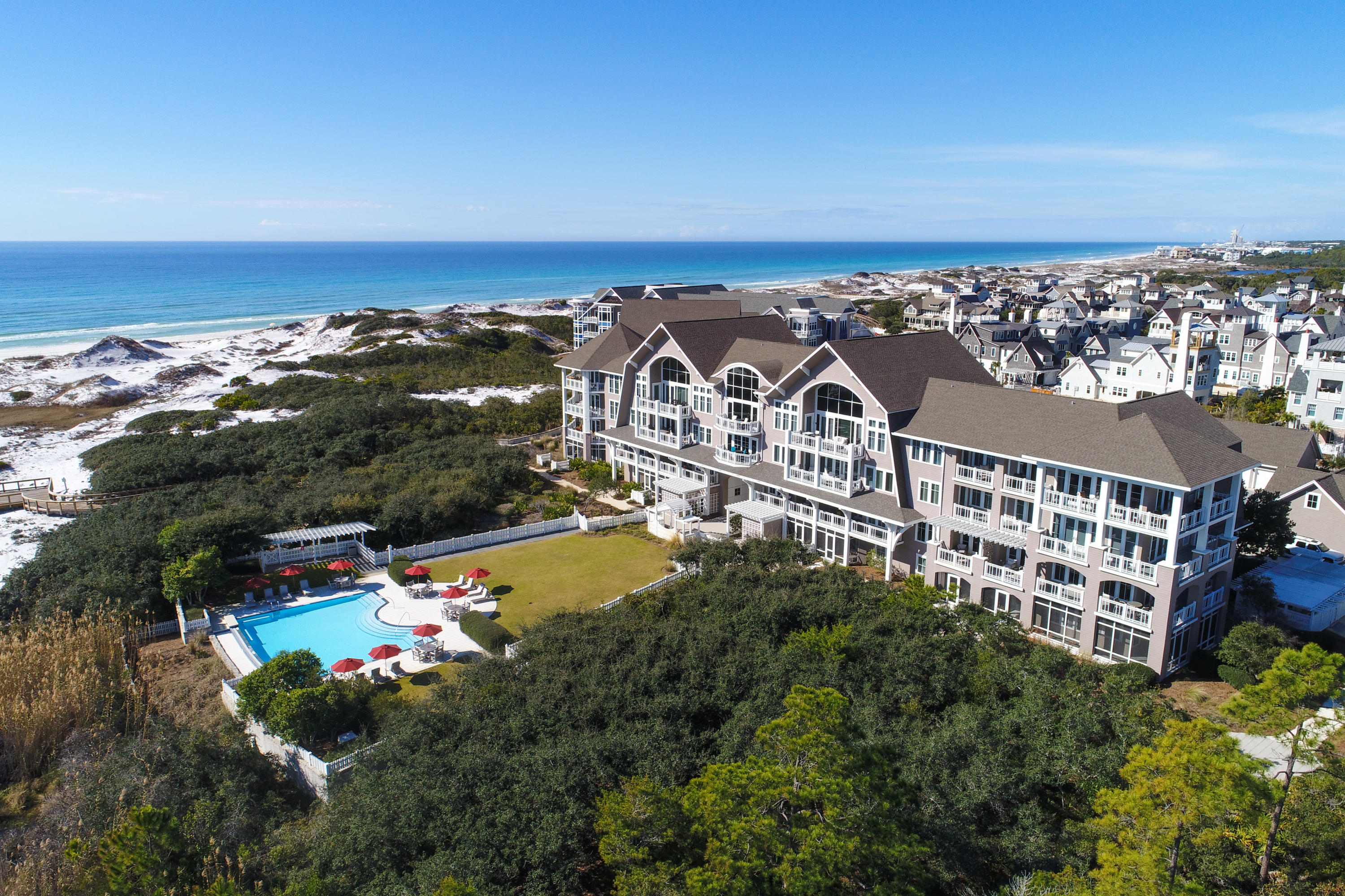 Price improvement! Opportunity is knocking on this uniquely designed and spacious top floor Watersound condo located within the main gates of Watersound at Compass Point II. When entering you are immediately greeted with serene, lush views of the grassy dunes and Gulf of Mexico through the stunning two-story floor to ceiling windows. The spacious and open kitchen is accented with custom cabinetry and luxury Viking appliances. The main living area is thoughtfully graced with 20' ceilings that accentuate the floor to ceiling windows. There is a multi- purpose third floor loft that could be design as additional sleeping or as an additional entertaining space to enjoy the exquisite views from sunup to sundown. The unit has been updated with new tile floors throughout the main areas. The private and large gulf front master suite is accented with a private balcony, direct views of the gulf, and a large master bath ensuite with separate shower and jacuzzi tub. The two additional guest suites also offer private ensuite baths. This stunning beach retreat offer easy access to all the luxury life style amenities of Watersound Beach, nature trails, private pools, parks, beach access, golf carts, biking, kayaking, and more. 
