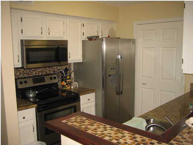 ** GROUND FLOOR, COMPLETELY UPGRADED UNIT ** THIS IS AN UNFURNISHED UNIT. This is not your typical Indian Lake unit. This upgraded unit features all custom tile, granite counters in the kitchen and bath, custom finished breakfast bar with stained wood and glass tiles, built-in bench in dining area, stainless steel appliances including built-in microwave in the kitchen, upgraded light fixtures, and a new outside AC condenser. Located in the Heart of Destin, across the street from the dog park, shopping, and within a mile to the beach. Amenities include club house, pool, workout room, picnic area, etc.