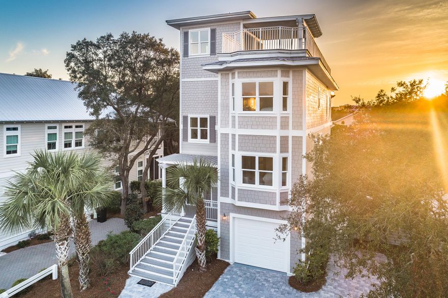 Spectacular custom built home just 1 block to the gulf with extraordinary views of the gulf and Big Redfish Coastal Dune Lake. This 4 level home located in Blue Mountain Beach has been completely renovated and updated. Boasting an oversize rooftop deck, it is equipped with a full wet bar and Bull gas grill for you to enjoy dinner, drinks or simply some chill-out time gazing at the unmatched views. There is also a large heated pool with plenty of space to lounge on the brick paver sun deck. This home is equipped with an elevator to easily travel to 3 floors. The great room is on the 3rd floor and is surrounded by large, sunny windows. Features of the main living space consist of an open floor plan, beautiful hardwood floors, raised ceilings with recessed lighting and a spacious covered balcony.  The roomy gourmet kitchen boasts stainless steel appliances, a gas stove, quartz counter tops, and an extra-large breakfast bar. There is a large bedroom and 2 full baths on the 3rd floor.  The 1st floor has a 2nd living area perfect for kids, with its own kitchenette, a bedroom with 4 full size bunk beds, and a bathroom.  The 2nd floor has 3 bedrooms, 2 of which share a balcony, and bathroom with shower/tub combo, as well as the master bedroom suite with its own private bathroom.  All 3 floors have large private balconies in the back.  Blue Mountain Beach, characterized by both lavish gulf front and private residences is a one-of-a-kind sprawling paradise set on the highest elevation along the Gulf of Mexico.  Enjoy unparalleled views across the gulf, beautiful beaches a block away, acres of forest and coastal dune lakes from this property.