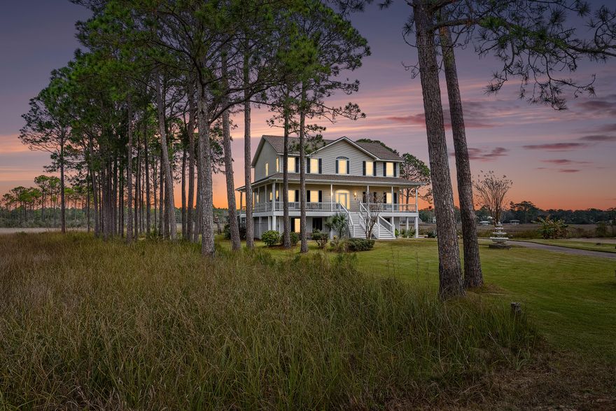 Stunning estate with private island! Water views from the wrap around porch and every window of this 3 story home. Entering the home you will see a grand staircase and hardwood flooring throughout. Kitchen has marble tile flooring and an island with a induction cooktop, counter depth sub-zero fridge, dishwasher and built in convection oven. Main floor has a large living room with panoramic views of the water, formal dining area and laundry room.  Also on the main floor is an office space with a large closet, half bath and french doors. Top floor has beautiful master bedroom, walk in closet and marble tile bathroom with soaker tub and separate shower. Two  bedrooms upstairs with a jack and jill bathroom. 3 car garage with oversized door, RV or boat parking pad. New roof! HVAC 2 years old.