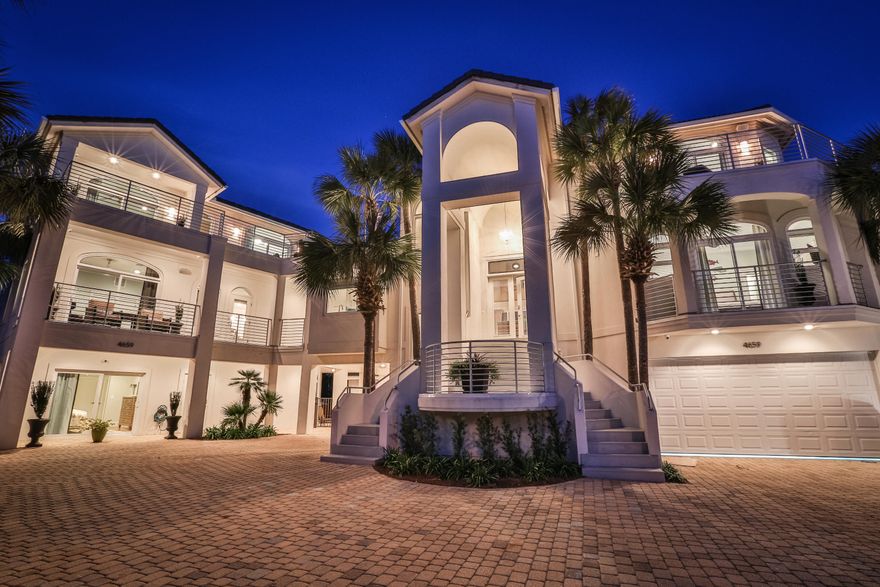 Masterly renovated, contemporary-style, lakefront residence with an infinity pool with swim-up bar, guesthouse, and Gulf views presents a fully orchestrated sensory experience. THIS PROPERTY WILL BE A RENTAL MACHINE AND HAS A 2015 RENTAL PROJECTION OF $300,000! Originally constructed by gutting and joining two adjacent properties, this recent extensive renovation preserved the footprint of the original home, while completely updating, modernizing, and improving the interior and exterior for a spectacular, turnkey primary residence or vacation rental property. Sea E O is composed of a main home and a guesthouse, connected by a covered breezeway, which surveys the Destiny community lake. A lakefront infinity pool with swim-up bar, elevated spa, and covered sitting area, gas fireplace, an outdoor kitchen will create a dramatic visual performance. Completely redesigned, the modern chef's kitchen in the main house offers custom cabinets, stainless steel Kitchen Aid appliances, a professional range, a large island, and wet bar. Offering a linear fireplace and wet bar, the renovated living area commands water views from its large wall of glass. The redesigned master suite, assuming the entire 3rd floor, features an expansive wraparound balcony with Gulf and lake views. The updated master en suite offers a custom tile shower and custom soaking tub. The guesthouse offers 6 bedrooms, updated kitchen and baths, laundry, and living area. This impressive total renovation includes new electrical wiring, new drywall, new plumbing, new Bryant A/C units, insulation, high efficiency tankless gas water heaters, smart home technology and more. The tile roof was reworked and painted. The stucco features a new sand texture finish. All cabinets were replaced with custom cabinetry. The renovation was conceived as a visual metaphor of the white sand beaches and emerald green waters that distinguish the Emerald Coast. Throughout the residence, expanses of glass frame vistas of the Gulf and lake. Located right across the street from the beach on Scenic Gulf Drive, Destiny "Destiny West" is considered one of the most exclusive gated communities in Destin. Owners and guests enjoy private tennis courts, a community pool and hot tub, and playgrounds for the kids. 