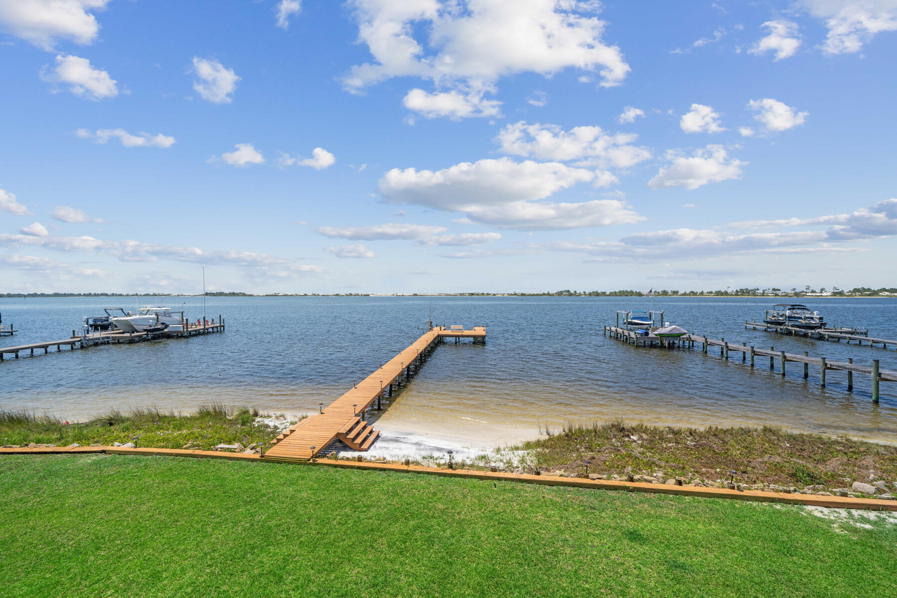 Experience the serene life of sunrises and sunsets across the Santa Rosa Sound within the coveted subdivision of SPARKLING WATERS in Mary Esther, FL! This stunning WATERFRONT paradise provides 100 ft of open water access, a 130 ft dock with power & water, a jet ski lift, and a 15x13 space for a boat lift! Step inside to see & feel the exquisite quality construction throughout the custom 3-story home that was meticulously designed to withstand hurricanes! From the expansive 4-CAR (tandem) GARAGE with a 1/2 bathroom, take the ELEVATOR up to the 2nd floor to experience remarkable views of the Sound and the Gulf from every window in the spacious living room and the enormous dream kitchen that features 2 islands, a pantry, granite countertops, and an eat-in nook! The 2nd floor also presents an electric fireplace in the living room, a large formal dining room, an office (that could also be used as a bedroom/playroom/gym), a 1/2 bathroom, and a 31x8 covered balcony with Trex decking. From the grand foyer on the 2nd floor, take the stairs or the elevator up to the 3rd floor to explore more radiant views of the sky and water from the master bedroom and the 2 guest bedrooms! The substantial master bedroom allows ample space for big furniture pieces, a sitting area, and it offers an electric fireplace in the corner. The master walk-in closets are large and lovely with custom closet systems in each. The tiled master bathroom features 2 separate vanities with cultured marble countertops, a separate soaking tub, and a spacious walk-in shower. Outside of the master bedroom you'll find yourself in the loft/bonus area of the 3rd floor that could be used as an open space for an anything such as a playroom/office/reading area/game room/etc.... The laundry room is next to this space and it is quite roomy with a storage closet, storage cabinets, and a large countertop space with a utility sink. Down the hall from the master bedroom are 2 guest bedrooms and a full Jack & Jill (Hollywood) style bathroom between them. All 3 bedrooms have their own separate outdoor accesses to the 31x8 covered balcony with Trex decking.
This beautiful 2006 built home boasts the following extra features: 9 ft ceilings on the 2nd and 3rd floors along with crown molding, hardwood flooring throughout the main areas and tile in the foyer, kitchen, bathrooms, and laundry room, surround sound, an intercom system, an in-home vacuum system, electric tankless water heater, 2 HVAC units, a 2006 metal roof, gutters, an outdoor shower, a well pumped irrigation system, and a brick paved driveway. Seller is the original owner who pays $190/month for FPL and $103/month for water/sewer/trash. The HOA is only $500 per year! Short term rentals are not allowed in Sparkling Waters. The property is located in an AE flood zone which does require flood insurance. Seller currently pays $2,342 for flood insurance and $5,017.62 for home insurance. Both policies are with USAA. Call for more info or to schedule a private tour! 