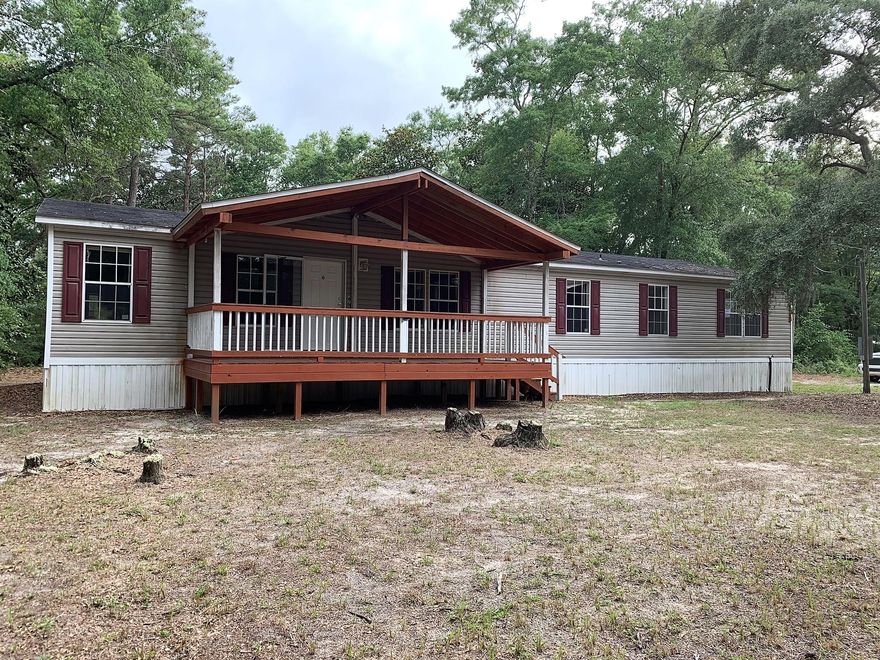 REO - CHECK IT OUT! A manufactured home LOCATED in Freeport UNDER $100k! This home sits on ONE acre and features a family room, den, four bedrooms, 2 bathrooms and a large kitchen! Come live closer to the beaches!