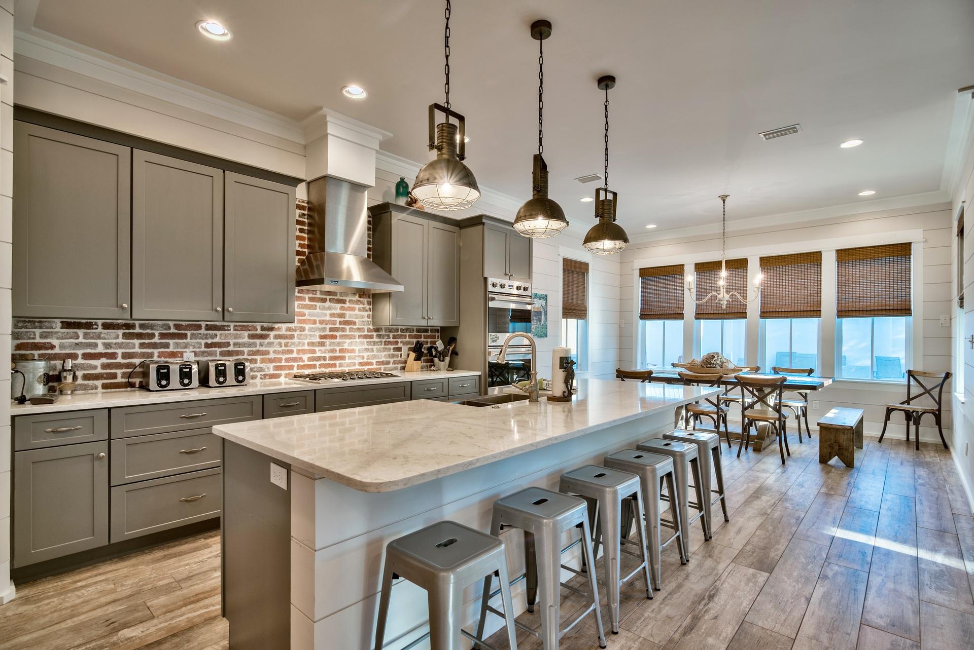 Coveted area of Old Seagrove - ''Big Sandy'' is a luxurious home with 8 bedrooms and 8.5 bathrooms to accommodate up to 26 guests. A perfect beach home for those wanting to be near the beach, shops, and restaurants, while also maintaining some privacy, as the home is located on a tree-lined street just off of 30A & 395. Entering the home, you will be greeted by beautiful wood-tile flooring, exposed wooden beams, and shiplap walls leading into the open first floor family areas. The masterful kitchen is complete with quartz counters, stainless steel Viking appliances and a large center island. The kitchen accommodates large groups by providing double ovens, two dishwashers, and a five-burner gas range. A covered outdoor rear porch allows for grilling in the shade. Heated spa & pool