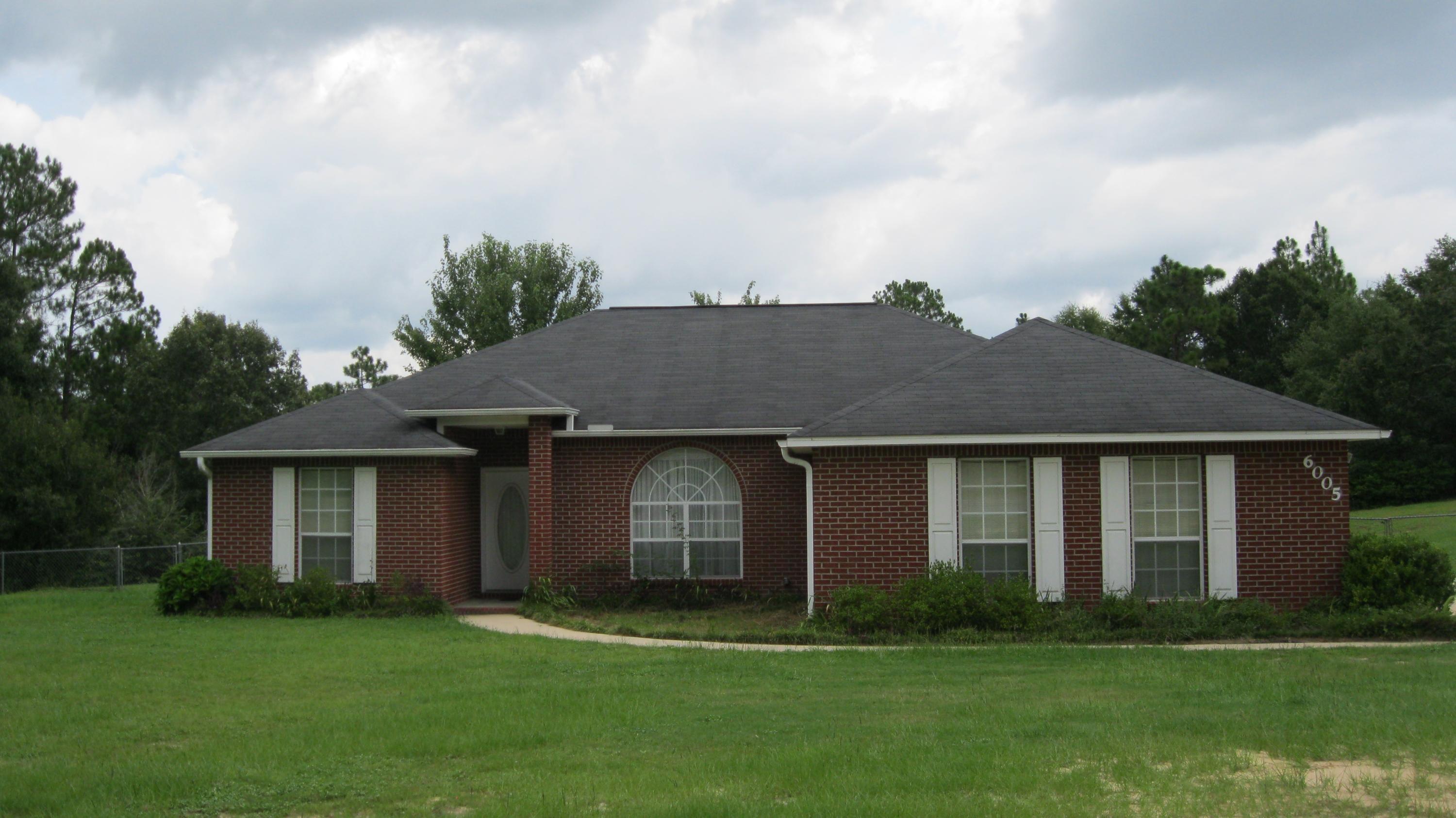 Available August 16, 2014. If you are looking for peace and quiet, this place is for you. This home is located on 2 acre level lot that is surrounded by trees so all you hear are the sounds of nature. Very nice all brick 3 bedroom 2 bath home, newly painted with split bedroom floor, easy commute to the bases. This house features an eat-in kitchen with a breakfast bar, plenty of counter space and cabinets, pantry and comes with all the appliances you'll need (side by side refrigerator with icemaker, stove, microwave, and dishwasher). Open floor plan with formal dining room, living room has cathedral ceilings with nice fireplace, French door to the extra large back patio and large eat-in kitchen. The master bedroom suite also has French door to the back patio, master bath, large walk-in