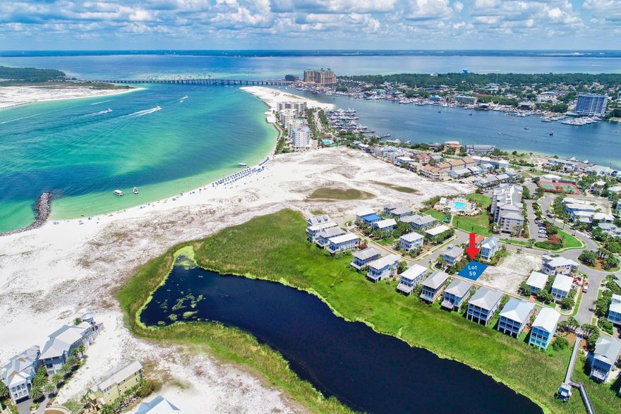 Gulf, pass and lake views are afforded from this homesite located inside the private gated community of Destin Pointe. It is ideally situated to allow for lake views in addition to views of the Gulf of Mexico & Destin's East Pass while featuring deeded beach access and extraordinary proximity to Destin Pointe's numerous community amenities. Destin Pointe is a one of a kind gated island community that offers two pools, two coastal dune lakes, shuffle board and tennis courts. Whether your passion is Fishing, Snorkeling at the jetties, tennis or relaxing on the more than 3,000 feet of white sand beaches, Destin Pointe is an island neighborhood that affords it all.