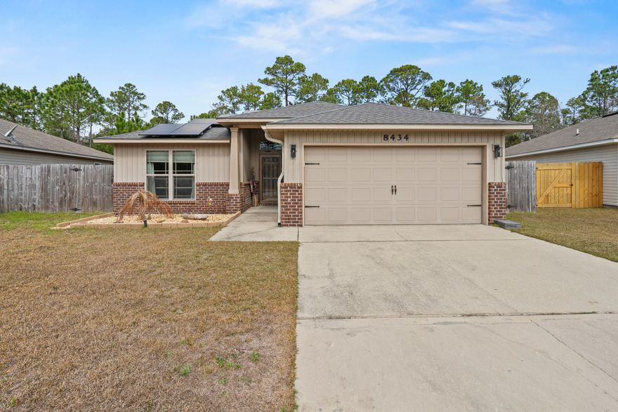 Welcome to your slice of paradise in Navarre, Florida! This beautifully maintained 3-bedroom, 2-bath home offers a thoughtfully designed living space just 2 miles from the white sandy beaches of Navarre Beach! Step inside to a spacious, open floor plan that's perfect for entertaining family and friends. Recent updates give this home a fresh feel, including new flooring in both guest bedrooms, fresh interior paint, new dining and kitchen light fixtures, and updated ceiling fans throughout (excluding the primary bedroom). Mounted TV outlets. The garage has been upgraded with newly added cabinets, storage shelving, and a workbench, offering excellent functionality and organization. The laundry room has also been enhanced with new shelving and cabinetry for additional storage. Two brand new barn-doors were added, one in the laundry room and the other in the primary suite.
Outside, enjoy updated landscaping in both the front and backyard, complete with patio blocks and stone accents -- perfect for relaxing evenings or weekend get-togethers while enjoying fresh ocean breeze and our beautiful emerald coast sunsets! 
The solar panels are paid off! Enjoy lower utility bills at no extra cost! Conveniently located to both Eglin AFB, Hurlburt Field, 7th Special Forces Group (Airborne) and Pensacola NAS.
