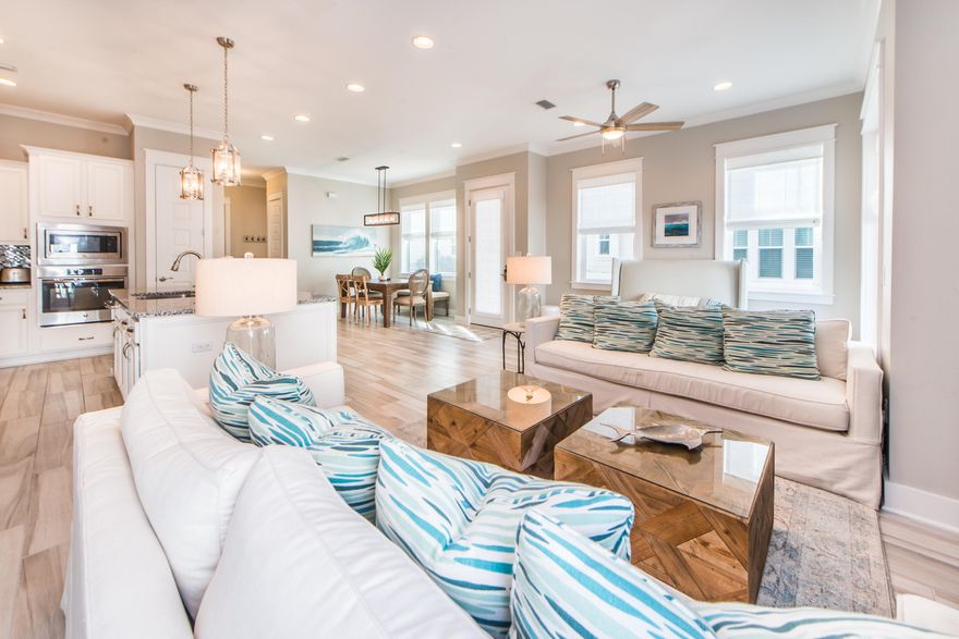 Extremely rare opportunity to own the only four-bedroom townhome located in the highly desirable community of Prominence North. This one-of-a-kind, highly appointed (A) unit from phase 1 is full of coastal charm featuring (4) bedrooms with (1) located on the first floor,(2.5) bathrooms, a one-car garage & boasts $100k of stunning, high-end ceiling to floor furnishings & upgrades! Serving as the former model home, this pristine luxury unit is considered the best location in Prominence North; steps away from the main entrance, resort-style community pool & the HUB. From the converted extra room space in the garage to the professional decor this unit is full of ultimate style, sophistication, comes fully furnished, has strong rental projections of $60K+ and includes 6-seater golf cart!