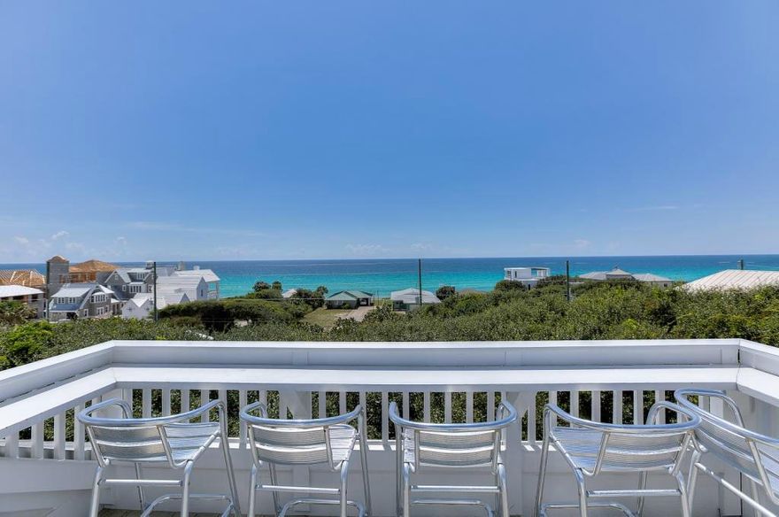 Take advantage of this rare opportunity to own a newly remodeled beach home in historic Old Seagrove. Enjoy spectacular gulf views from the rooftop deck and an unbeatable location just a short walk from the beach, restaurants, shops and the popular community of Seaside. Completely updated in 2013, this spacious home of 4,166 square feet includes 6 bedrooms, 6 bathrooms, two living areas and a private, heated swimming pool. The design of the home offers modern conveniences while also reflecting the charm of the neighborhood with covered porches, a metal roof, wood ceilings and hardwood and tile floors. The fourth floor tower room and sundeck is the perfect spot to enjoy sunset with a wet bar and refrigerator. Beautiful oak trees surround the fenced in backyard where the newly