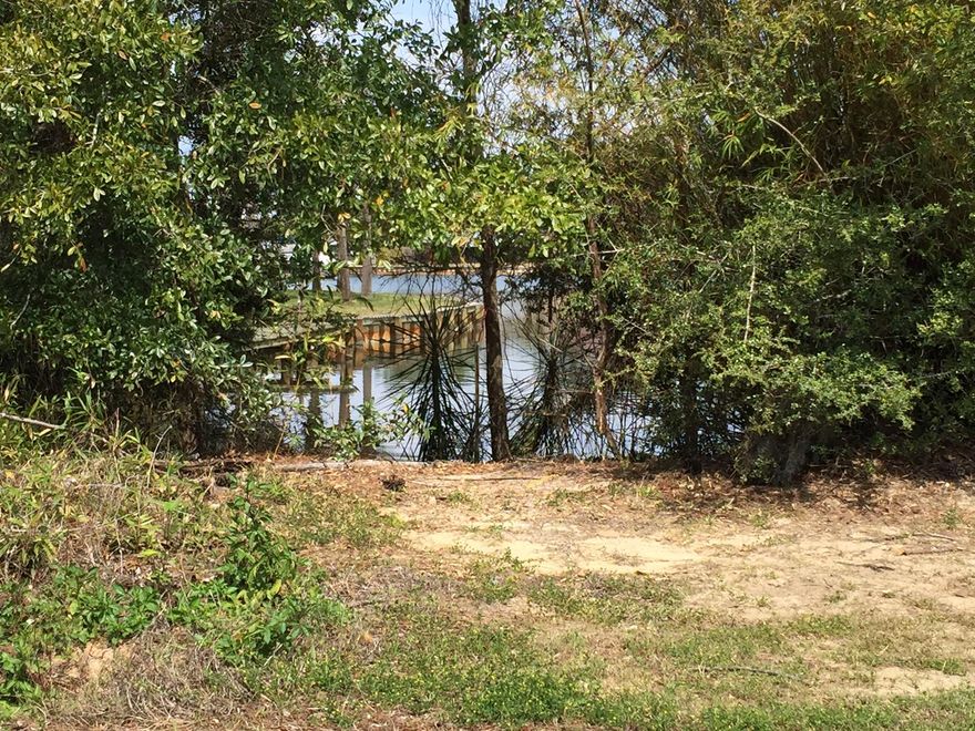 Great spot to build a home with water access to Honeymoon cove and into the Bay. Deep water.