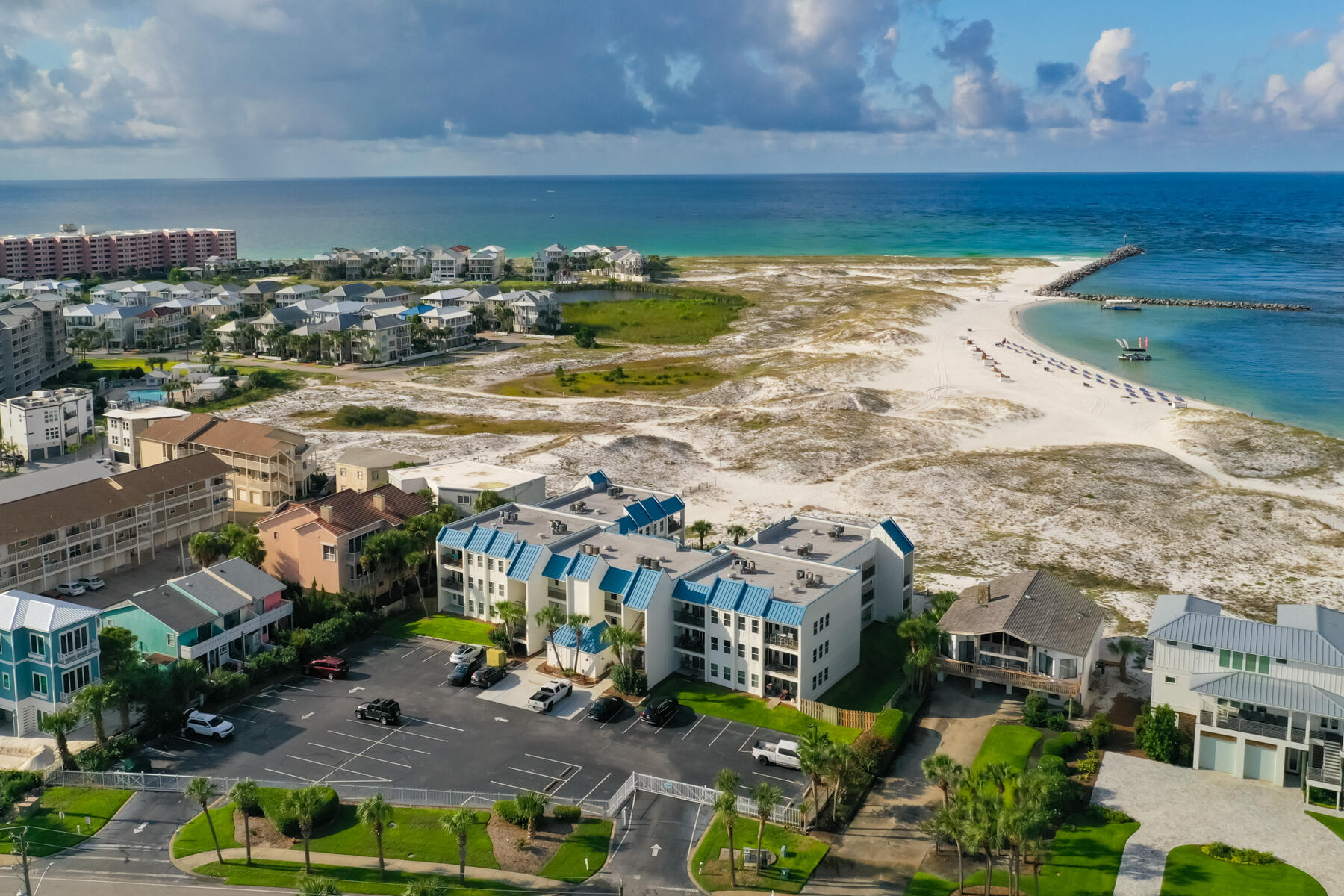Welcome to your own slice of paradise at Poolside Villas on Holiday Isle!This beautifully maintained 2-bedroom, 2-bath condo offers the ultimate beachside lifestyle with direct private beach access and a sparkling community pool. Located in a gated, 30-unit complex, Poolside Villas has a strong rental history, making this an exceptional investment or second home.Recent upgrades to this community include the completed State Milestone Inspection and a $2 million exterior renovation, giving you peace of mind for years to come. Inside, you'll find a bright, coastal-inspired interior with durable LVP flooring, an in-unit washer and dryer, and a well-appointed kitchen... ready for your favorite recipes. From the entry area, step out to a balcony overlooking the Gulf, where you can enjoy beautiful sand dune scenery, coastal breezes, and the occasional fireworks show. The living area opens to a second balcony that looks out to the Harbor making it the perfect spot to experience charter boats return through Destin's famous, East Pass.
This condo offers flexibility as a full-time residence, vacation home, or income-producing property, all conveniently located near a variety of shopping, dining and entertainment. You'll even have water taxi access to the Harbor, making it easy to enjoy the area without driving.
Don't miss this opportunity to own a total turnkey beach getaway in one of Destin's most peaceful and picturesque settings!