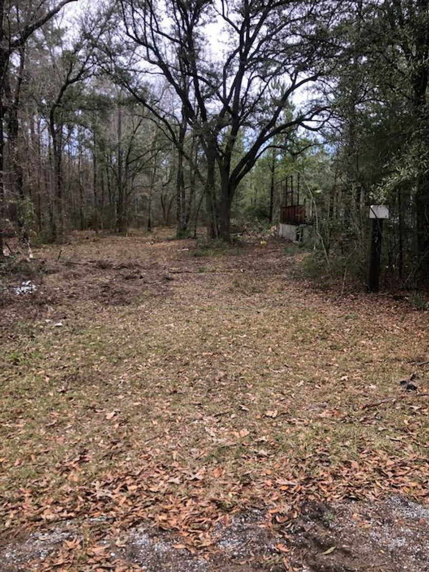 Commanders Landing is at the end of this new paved road. Power, septic &  well, more info included. This piece of property is appx 5 acres, you will own both sides of the road so no one can build across from you. Appx. 4 acres on one side of the road and appx 1 on the other side of the road.  The seller hasn't lived there in a long time so there is some clean up needed.  What a great opportunity to invest or have a beautiful place for a home!  There is an old mobile on the property, no value. The property has a septic tank.  The power pole is there but needs replacing and at one time the well worked but not now.  Seller doesn't know the current condition of the well, septic, or power pole, however, everything worked when they lived here. Buyer to verify info