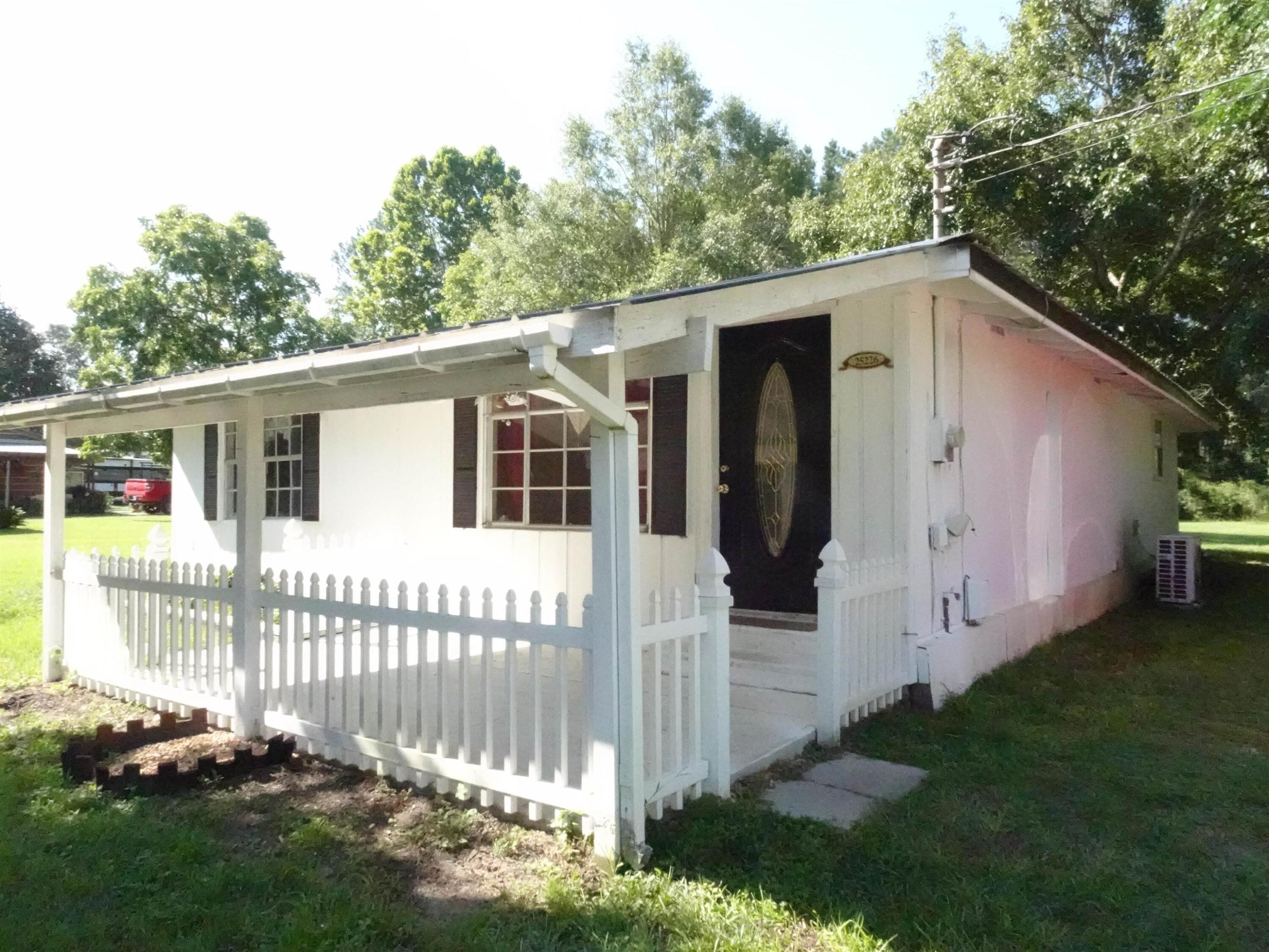 Cute 2BR bungalow located just outside of Florala! Home was updated in 2022 and 2023 and offers a great size living room, a large open kitchen with gas stove, kitchen island, tons of cabinets and eat in area that overlooks the family room allowing family time while entertaining and also while cooking. Both BR offer large size rooms and could accommodate more than 1 child per room. The primary bathroom has all the things on your check list as well! Home also includes a covered side porch with wood burning fireplace that is great for morning coffee or late-night relaxing. Home has tons of storage; yard includes 2 detached carports and workshop area and room for outside activities! Looking for your new home or an investment - new roof, new split units and plenty of space! Price is firm.