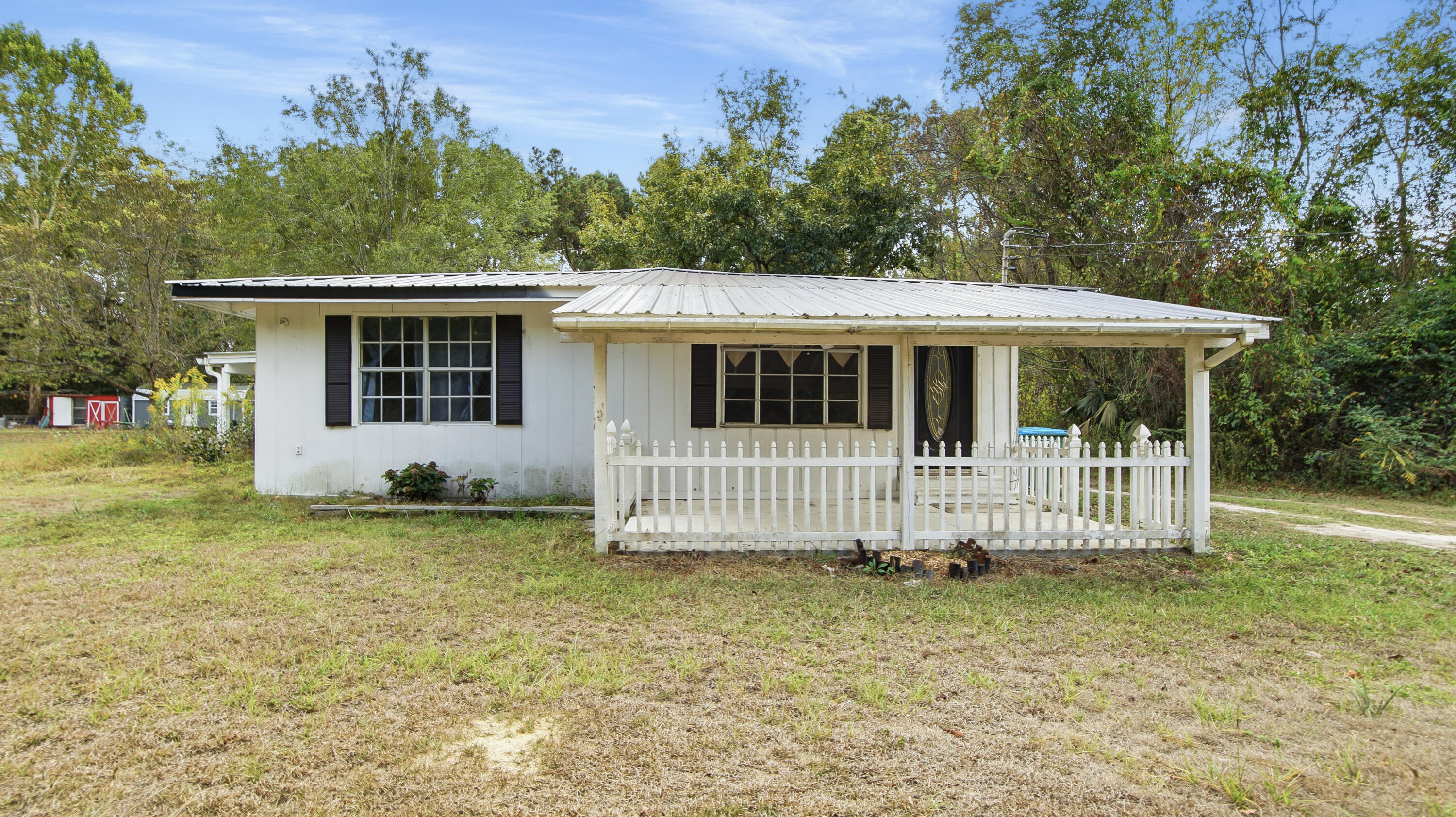 Cute 2BR bungalow located just outside of Florala! Home was updated in 2022 and 2023 and offers a great size living room, a large open kitchen with gas stove, kitchen island, tons of cabinets and eat in area that overlooks the family room allowing family time while entertaining and also while cooking. Both BR offer large size rooms and could accommodate more than 1 child per room. The primary bathroom has all the things on your check list as well! Home also includes a covered side porch with wood burning fireplace that is great for morning coffee or late-night relaxing. Home has tons of storage; yard includes 2 detached carports and workshop area and room for outside activities! Looking for your new home or an investment - new roof, new split units and plenty of space! Price is firm.