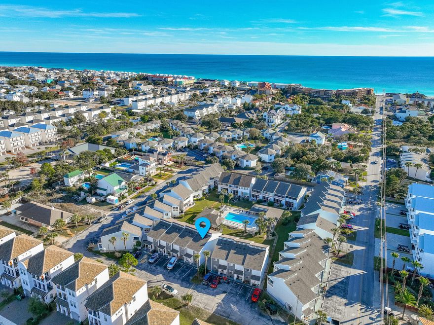 Experience coastal living in the charming Misty Cove townhome, perfect for full-time living, a second home, or a lucrative investment with $45,000 in rental potential. Just 1800 feet from Miramar Beach Regional Access and adjacent to Pompano Joe's Seafood Restaurant, enjoy free parking, restrooms, and wash stations. Revel in sun-kissed shores and a vibrant local scene, while the townhome boasts modern updates like granite countertops, stainless steel appliances, and chic white shaker cabinetry. New French doors lead to a screened-in patio with a tranquil pool view, enhancing the 2BR, 2.5BA space. Practical features include a full-size washer/dryer and fully-stocked beach gear storage: umbrellas, toys, chairs, grill - guest-ready! With an established VRBO listing & immediate rental income. Proximity to Seascape Towne Centre and multiple beach accesses ensures leisure and convenience. As a townhome, not a condo, enjoy financial advantages by avoiding costly non-conforming condo-tel financing. Uncover your beach haven in this beautifully positioned Misty Cove home.