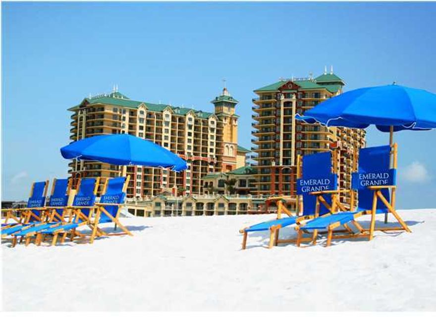 Welcome to Emerald Grande! An experience like no other in all of Destin! Upon arrival, you will be greeted by bell service who will unload and deliver your belongings directly to your private home away from home. Emerald Grande is the centerpiece of HarborWalk Village with restaurants such as Harry T's and the soon to open Margaritaville, retail shops and boutiques, and Destin's Fishing Fleet, the largest charter boat fishing fleet in all of Florida! This resort is one of the most sought after locations along the Emerald Coast. Your condo features a large wrap around balcony (+1 additional balcony off two of the guest bedrooms) with stunning water views as never before seen. Custom high end furnishings, a full electronics, and house ware package are already in place for your