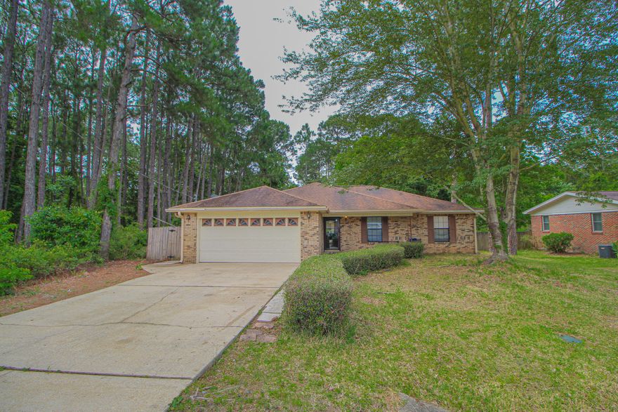 LOOKING FOR A HOME IN A PRIVATE NATURAL SETTING? You will love entertaining your family and friends in this open and spacious living area with cathedral ceilings and a corner fireplace with mantle. Dining area is open to the living room and has tile flooring and windows that overlook the backyard. Kitchen has lots of counter space to include a large center island with a breakfast bar. Large master bedroom with a private that has double vanities and a skylight for natural light. Two additional twin bedrooms and a hall bath complete this side of the home. There is an additional 4th bedrooms that could easily be used as a den or game room. Large utility/laundry room with extra shelves for storage. Backyard has a large open patio perfect for cookouts, fully fenced and a shed. Close to area beaches, shopping, schools and Hurlburt AFB.  Call today to take a look inside.....