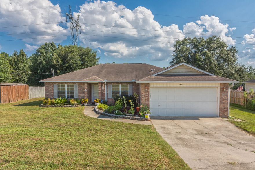 New roof with accepted offer! Looking for a South Crestview home nestled in a quiet neighborhood? This is it! This well maintained FOUR bedroom home features a split floor plan, large living room with vaulted ceilings, and a spacious eat-in kitchen plus hardwood and tile floors throughout common areas. The kitchen is a cook's delight with newer stainless steel appliances, large single basin composite sink, island with storage, and a ton of cabinets! The master bedroom and three additional bedrooms are nicely sized with the master bath featuring double vanities, walk-in closet, linen closet, and toilet room. Rounding out this home is the interior laundry room with cabinet space. Enjoy your morning coffee on a newly built deck made with composite boards, overlooking a nice wooded area.