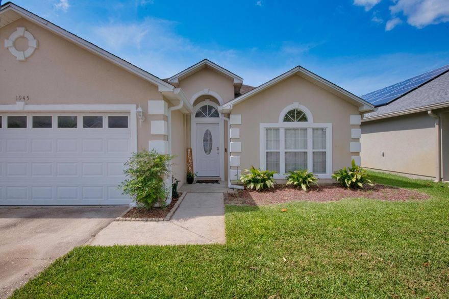 Welcome to 1945 Kadima Circle.  An open concept home with a split bedroom floor plan. With uninterrupted views of both the living and dining room, the kitchen is the heartbeat of this home.  The oversized kitchen island with breakfast bar and ample countertop space, this home is perfect for Friday night entertaining or Sunday morning pancakes. You'll love the the kitchen cabinet storage which include pot drawers and extra large organized pull-out drawers on either side of the fridge. The master bedroom is large enough for a king-sized bed, a dresser, night stands, and then some. The master bedroom connects to your master bath which includes dual vanities, garden tub, his-and-hers walk-in closets, and separate shower. Enjoy peace and quiet! The 3 guest bed and bathrooms do not share a  wall with the master bedroom. Grill steaks or enjoy a glass of wine on your giant covered patio. Watch your dogs run in the fully landscaped backyard. Laundry is a pleasure in your giant laundry room. Hard surface flooring flow throughout the living and dining rooms, the kitchen, master bedroom, and both bathrooms. Fresh carpet adorn the guest bedrooms.