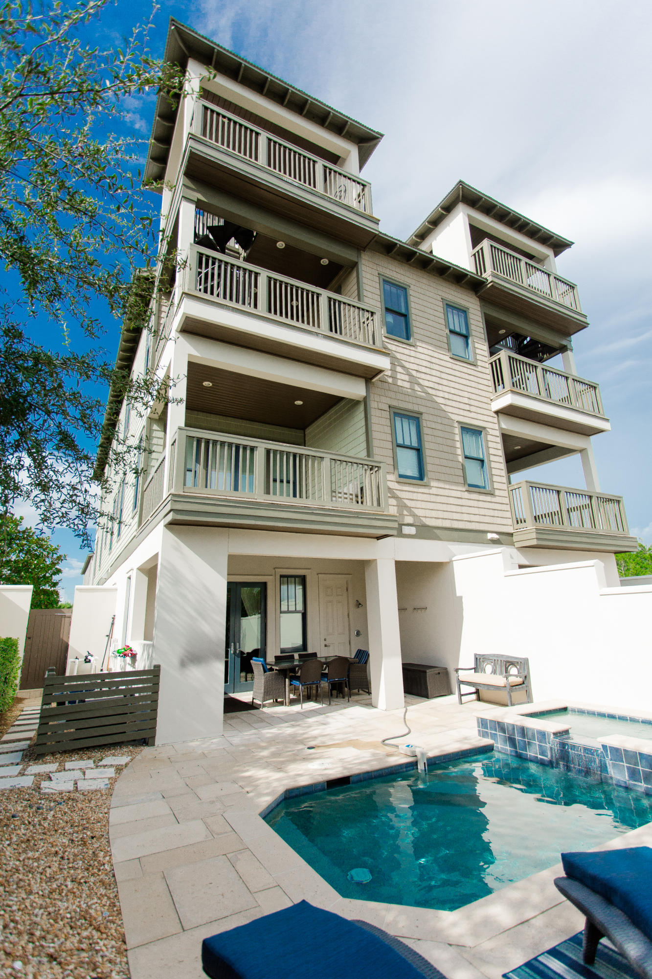 Welcome to 32 E Park Place Avenue, Unit #601, ideally located in the beautiful community of Inlet Beach. This home welcomes you in from the moment you step inside, with the gorgeous main living area, with views of the turquoise water, rich pine flooring, shiplap walls, and a chef's kitchen with white cabinetry, quartz countertops and professional grade appliances. The first floor also has a gorgeous courtyard with outdoor kitchen shower, and a private pool with spa. Beautiful French doors will welcome you to the outdoor living space.