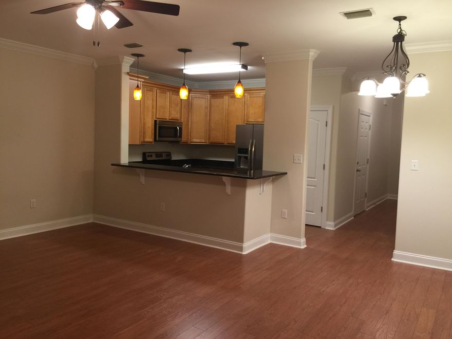 This is an upscale town home at an amazing price and located in the heart of Destin! Perfect for permanent living, second home, or rental investment property. Kitchen has granite counters and all brand new stainless steel appliances, including a counter depth french door new refrigerator. One car garage! Large master bedroom and bath and the two guest bedrooms share a bath. Large open great room with 1/2 bath on first level. Washer/dryer hook-ups on the bedroom level which is super convenient when time to do laundry. All new paint and new flooring as well as new lighting throughout. Home includes hurricane shutters. Easy to see and conveniently located in the heart of Destin.