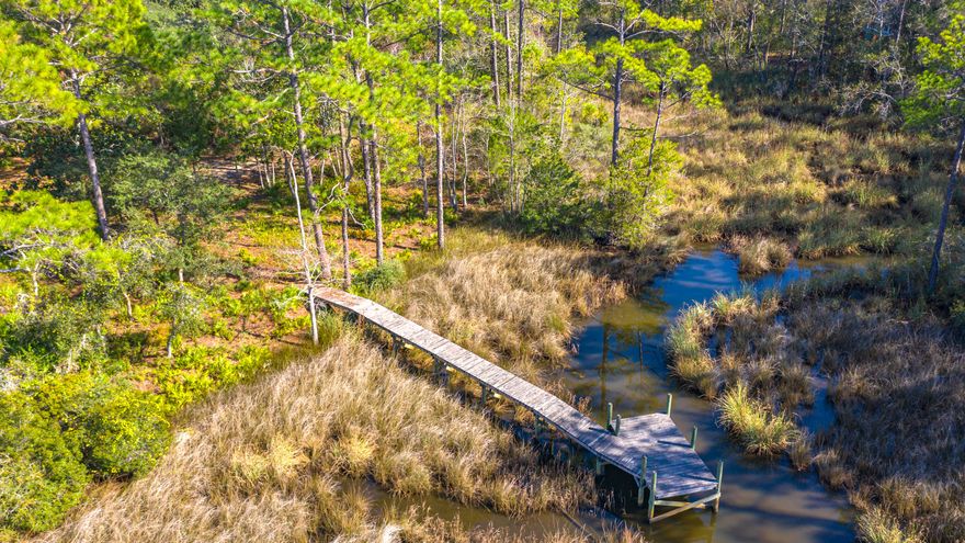 Currently under contract with 72 hour first right of refusal. Lot 13 Bayou Circle is located on the end of one of the most desirable bayous in Freeport. Offering just over a quarter of an acre and covenants and restrictions have expired.  Lot 13 features a pedestrian dock already in place (sold as-is)  and as I understand it, deep enough for a boat dock if one was desired. Just a few miles across the 331 bridge to the Beaches of South Walton, yet far enough away to get away from the hustle and bustle of the tourist.