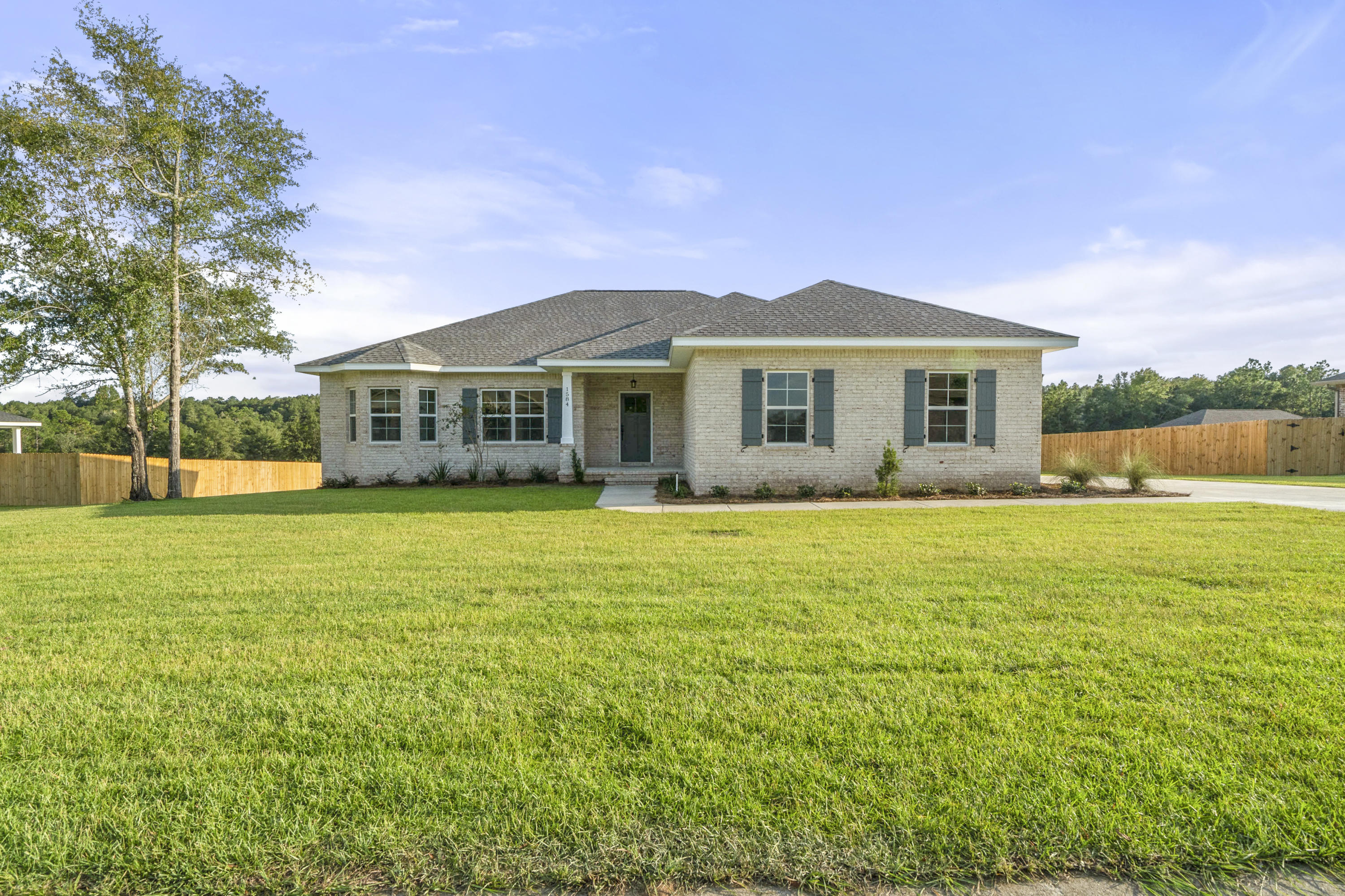WOW, new construction built by a Parade of Homes winner, on a 1/2 acre lot! This 4 bed 2 bath brick home will be stunning. Open floor plan where the kitchen overlooks the family room. Stainless steel appliances, including a refrigerator. Master bath has double vanities, walk in closet, soaking tub, and a separate shower. And don't worry, irrigation is included!