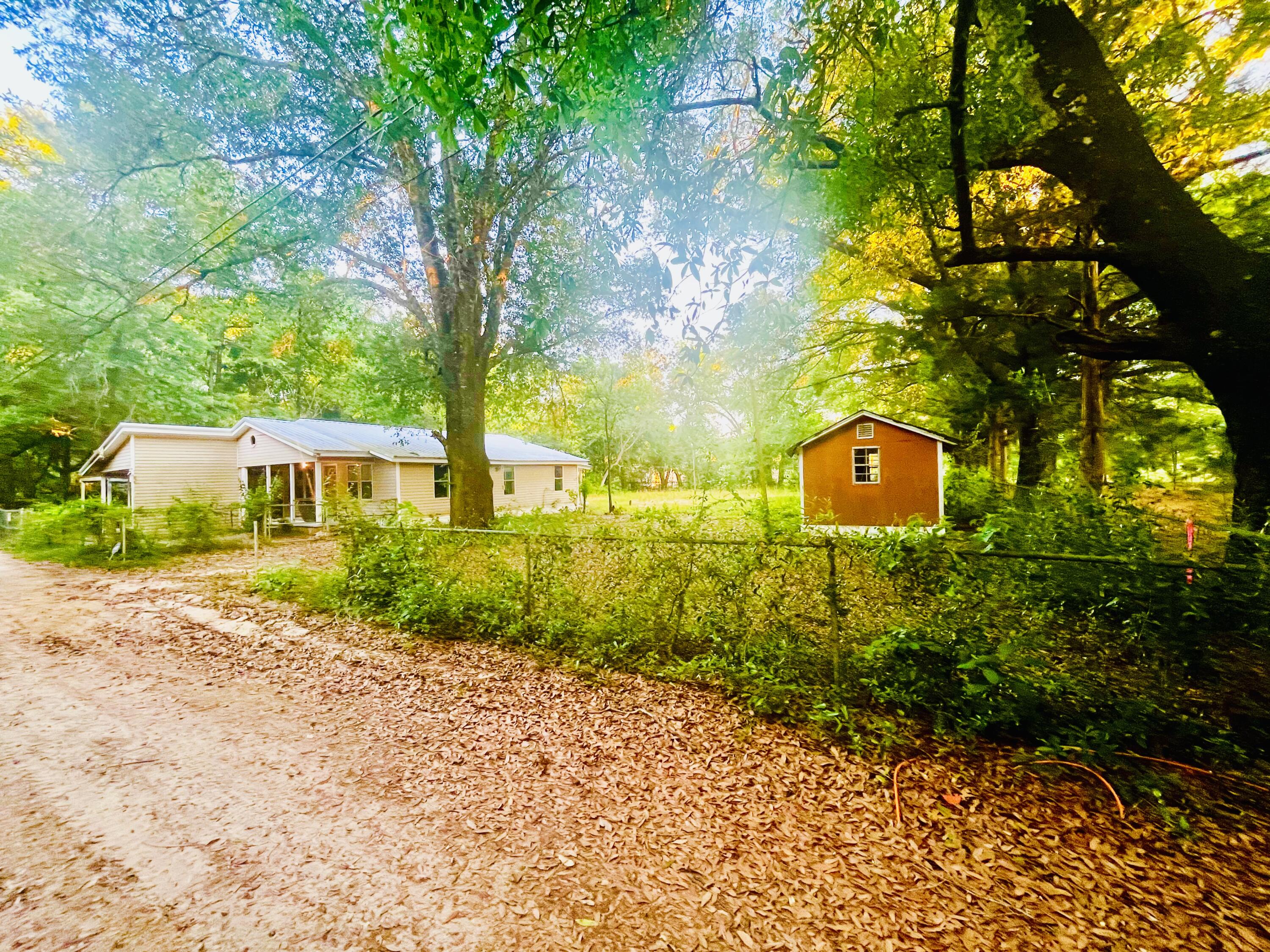 Investor Special or DIY Opportunity! This 2-bedroom, 1-bath home is located near Highway 90 and has been fully stripped down to the studs--offering a clean slate for your next project. Whether you're an investor looking for your next flip or a homeowner ready to customize every detail, this property provides the ideal foundation. Situated on approximately half an acre, there's plenty of room to create the layout and features that fit your vision. Property is being sold as-is and is ready for renovation. Zoned for commercial use, adding potential for future development or business use (buyer to verify zoning and usage with the county). Don't miss this opportunity!